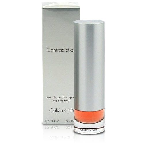 Zylindrische Flasche und Schachtel. Aufschrift: Contradiction, Calvin Klein. Flüssigkeit orangefarben. 1,7 FL OZ, 50 m.