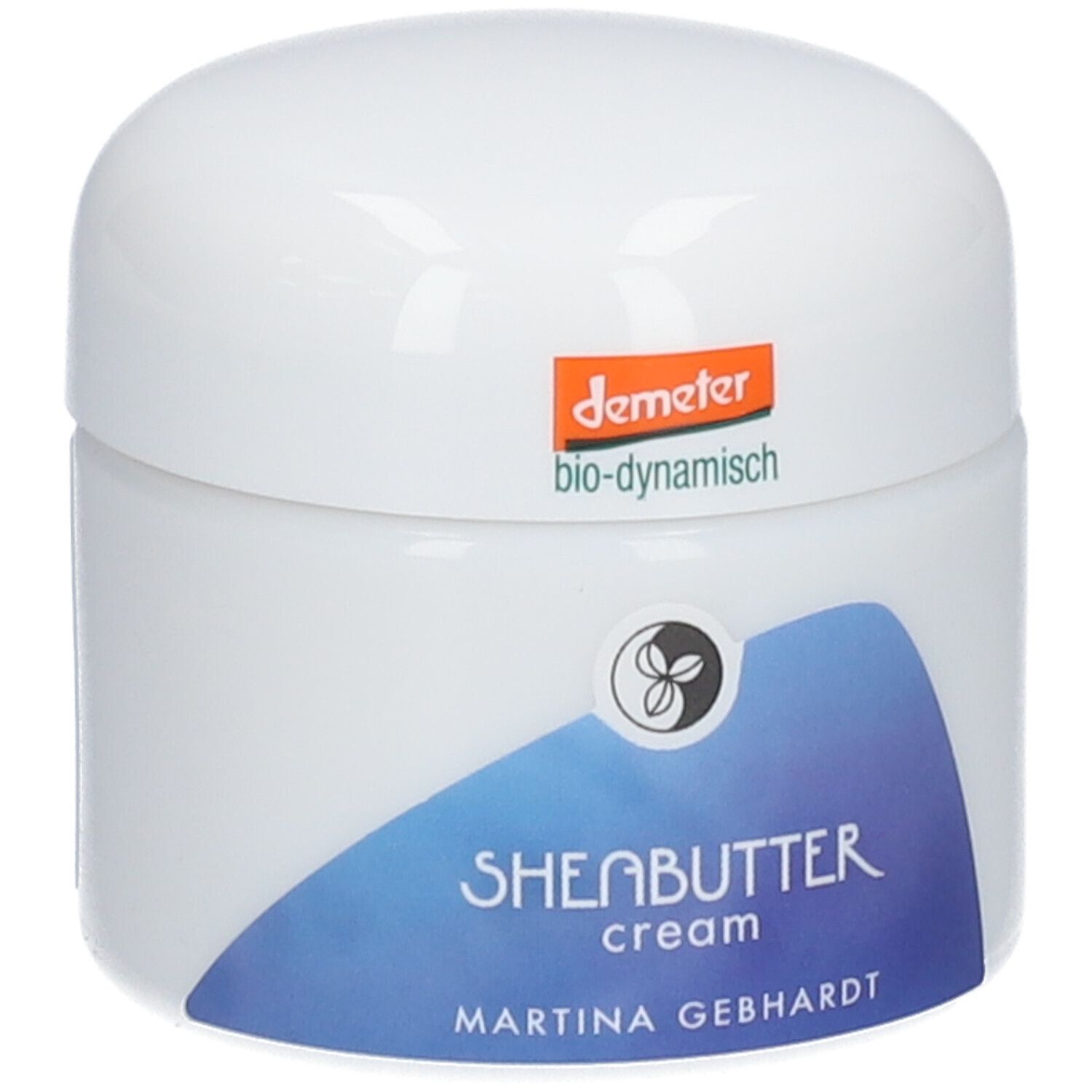Martina Gebhardt Sheabutter Cream: Weißer Tiegel mit blauem Etikett, Aufschrift 'SHEABUTTER cream'. Demeter-Siegel oben.