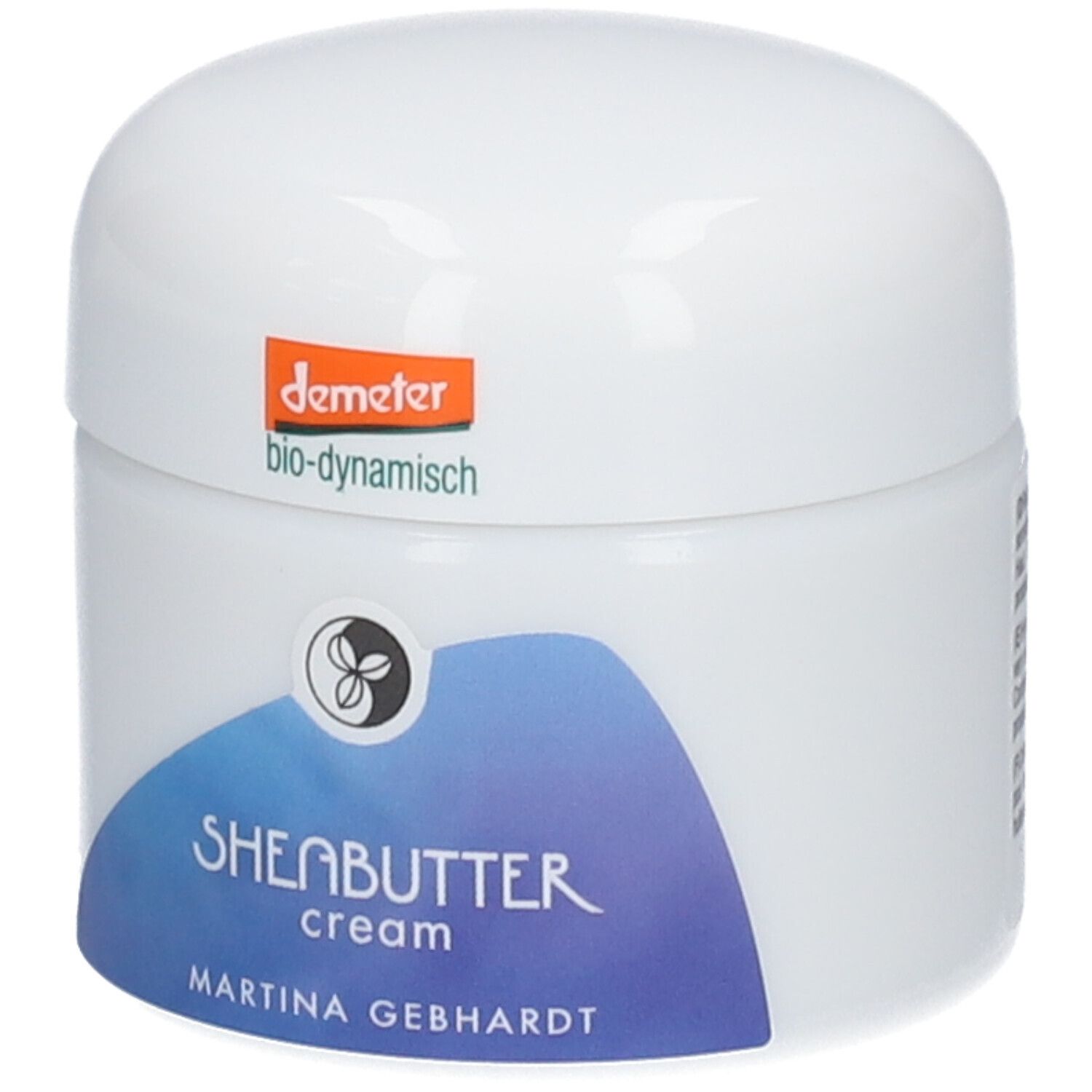 Martina Gebhardt Sheabutter Cream: Weißer Tiegel mit blauem Etikett, Aufschrift 'SHEABUTTER cream'. Demeter-Siegel oben.