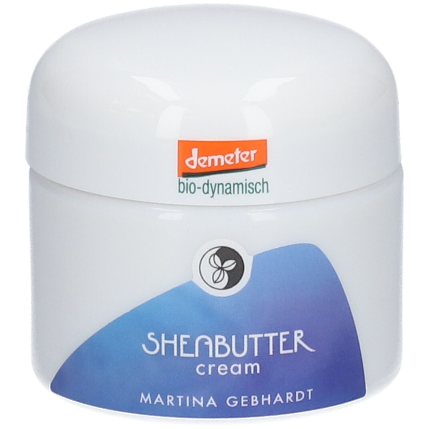 Martina Gebhardt Sheabutter Cream: Weißer Tiegel mit blauem Etikett, Aufschrift 'SHEABUTTER cream'. Demeter-Siegel oben.