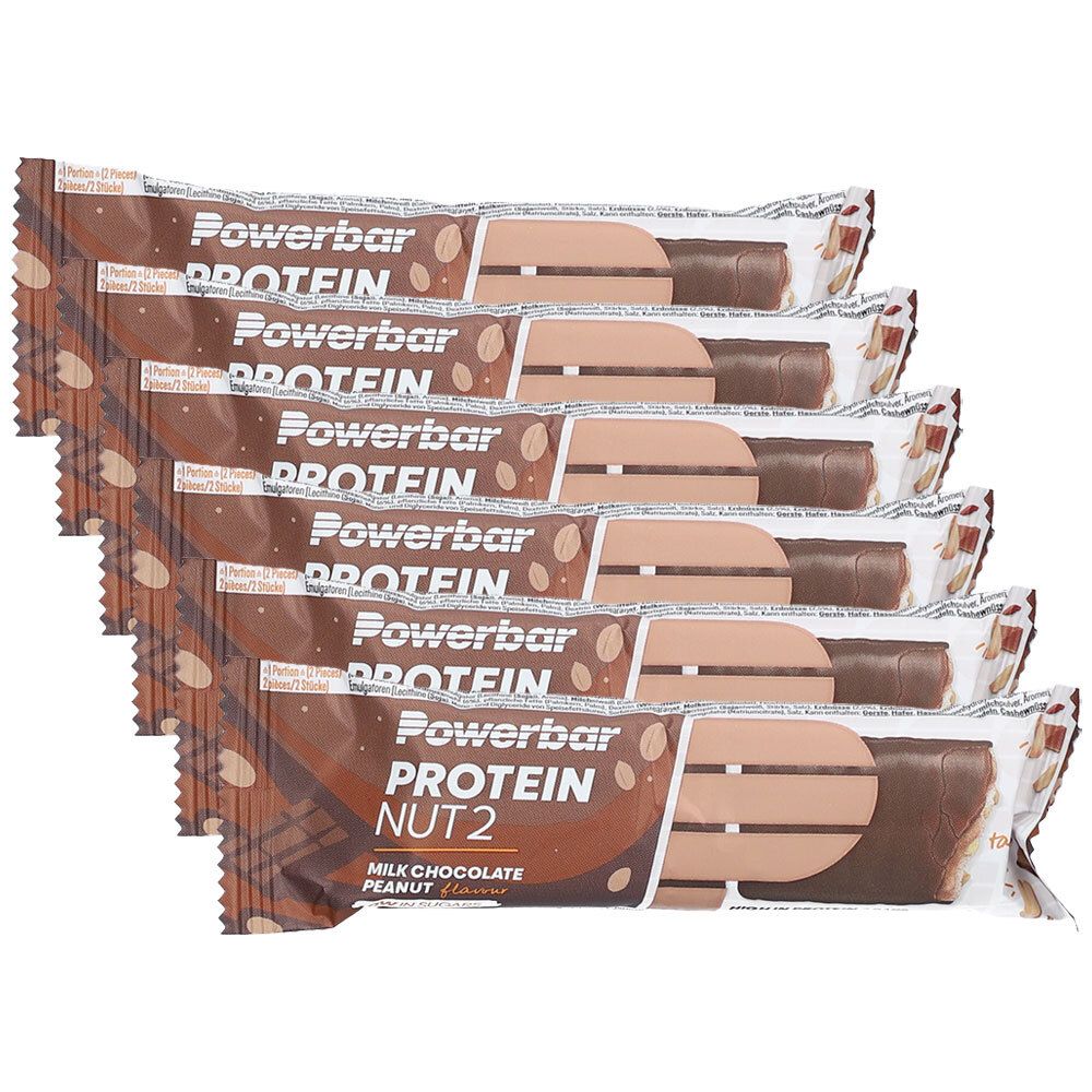 Six barres protéinées emballées. Inscription : Powerbar Protein Nut2 Milk Chocolate Peanut.