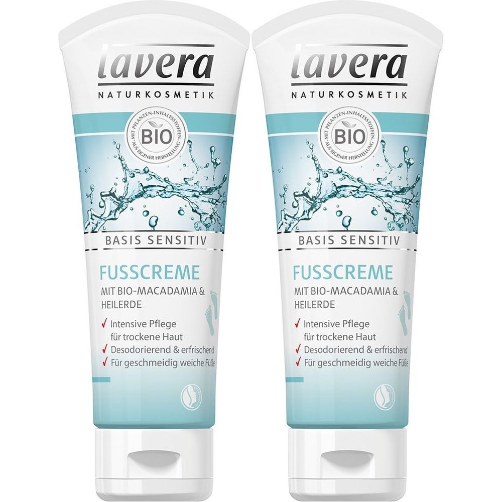 Deux tubes de crème pour les pieds. Tubes blancs avec design bleu, inscription 'Lavera'. 'Basis Sensitiv' et 'Fußcreme' sont lisibles. Label bio.