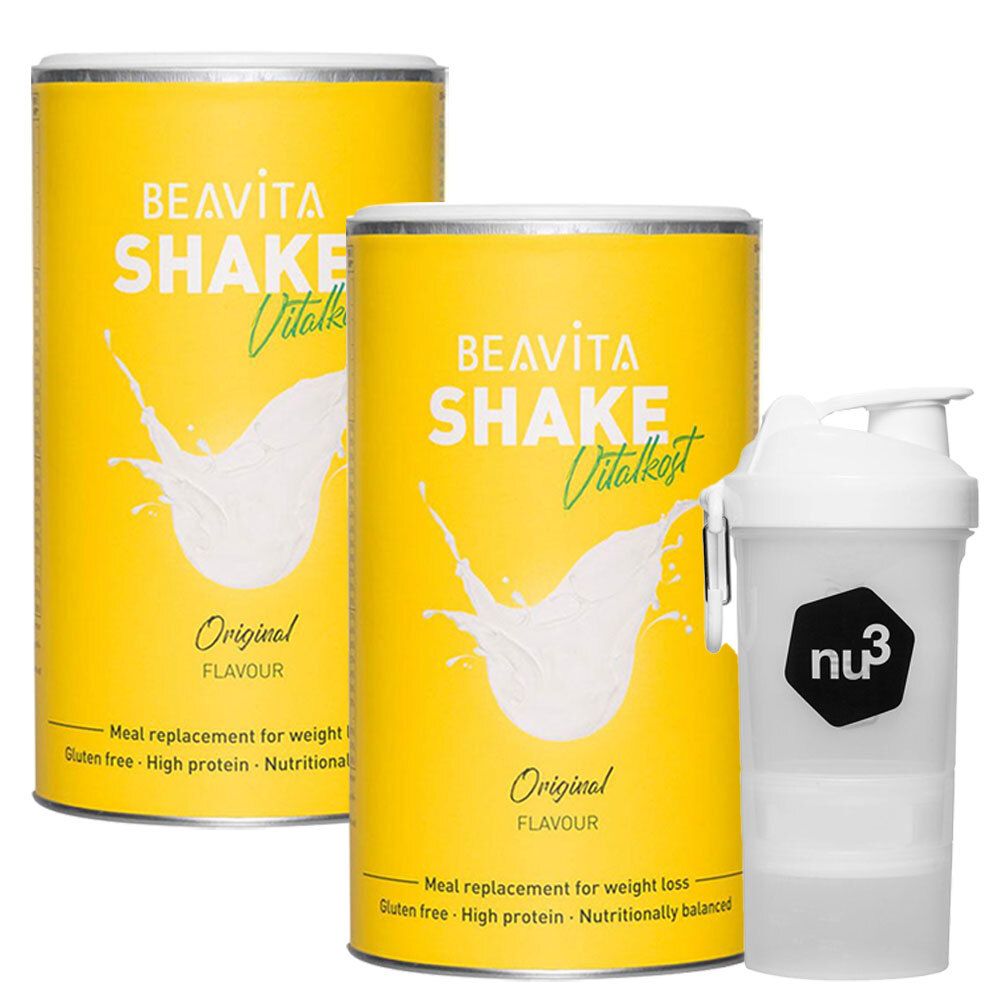 Deux boîtes jaunes BEAVITA Shake Vitalkost Original et un shaker blanc. Inscription : Original Flavour, sans gluten, riche en protéines.