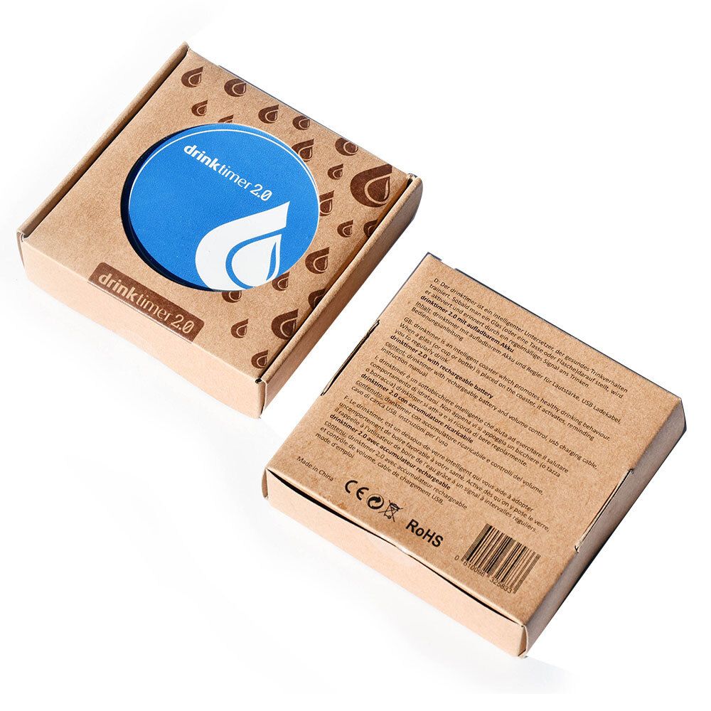Produktverpackung mit blauem Drinktimer 2.0. Braune Kartonverpackung mit Wassertropfen-Design. Deckel mit Produktlogo.