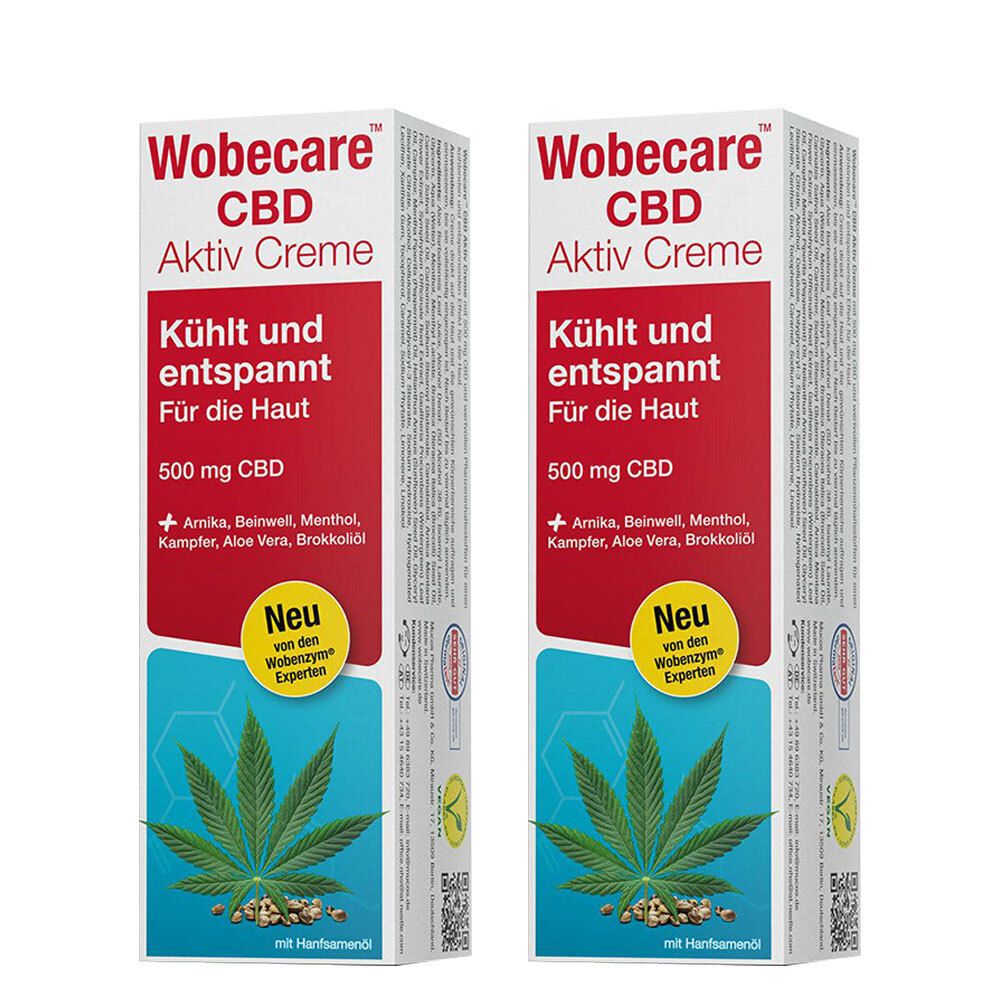 Zwei Packungen Wobecare CBD Aktiv Creme. Weiße Verpackung mit roter und blauer Schrift. Enthält 500 mg CBD. Mit Hanfblatt-Illustration.