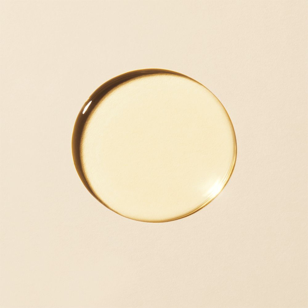 Goutte d'huile circulaire. Couleur jaune clair. Sur fond clair.