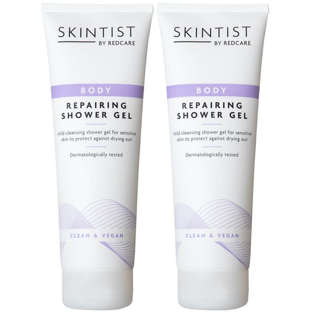 Deux tubes de gel douche réparateur SKINTIST Body avec offre 1+1. Tubes blancs avec détails violets et texte. Végétalien.