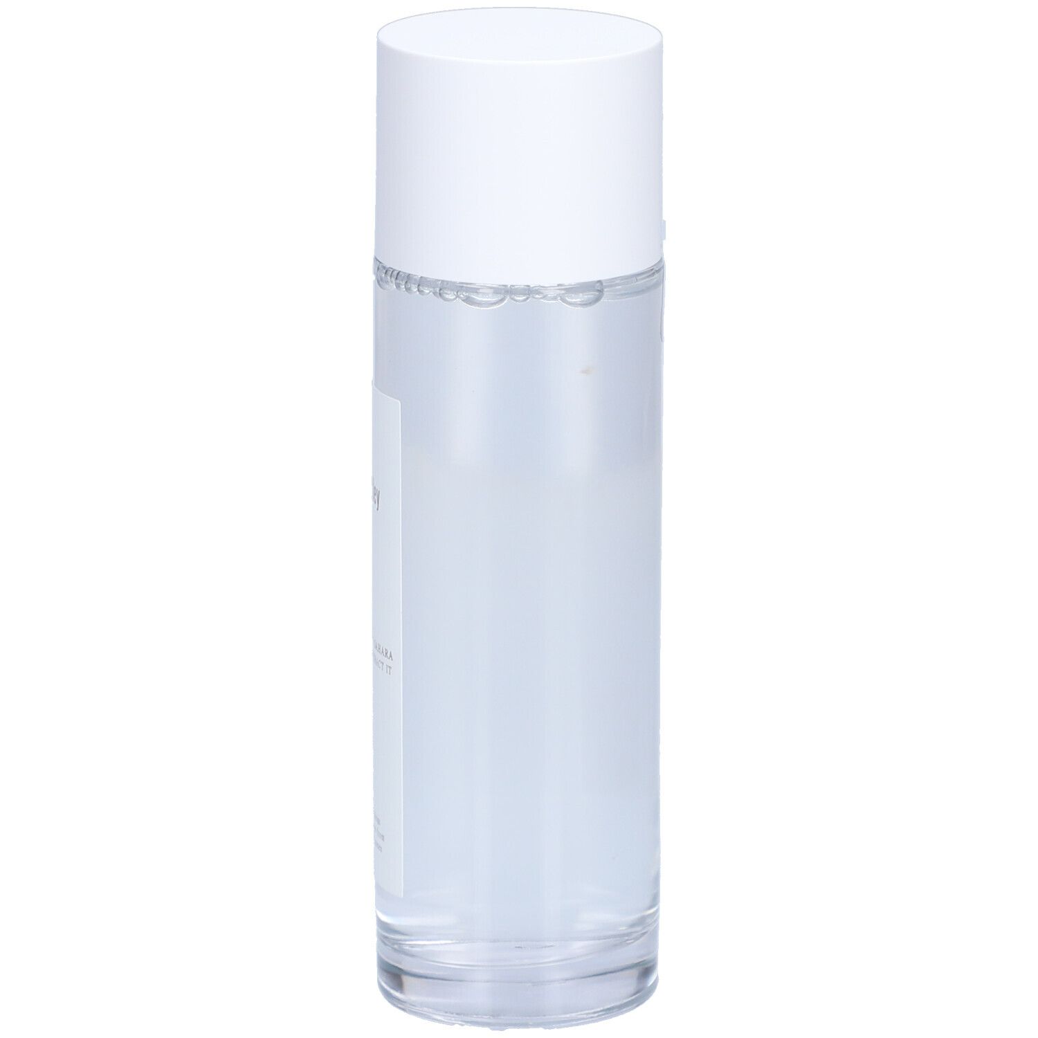 Flacon cylindrique blanc avec bouchon. Étiquette avec informations produit. Liquide clair visible.