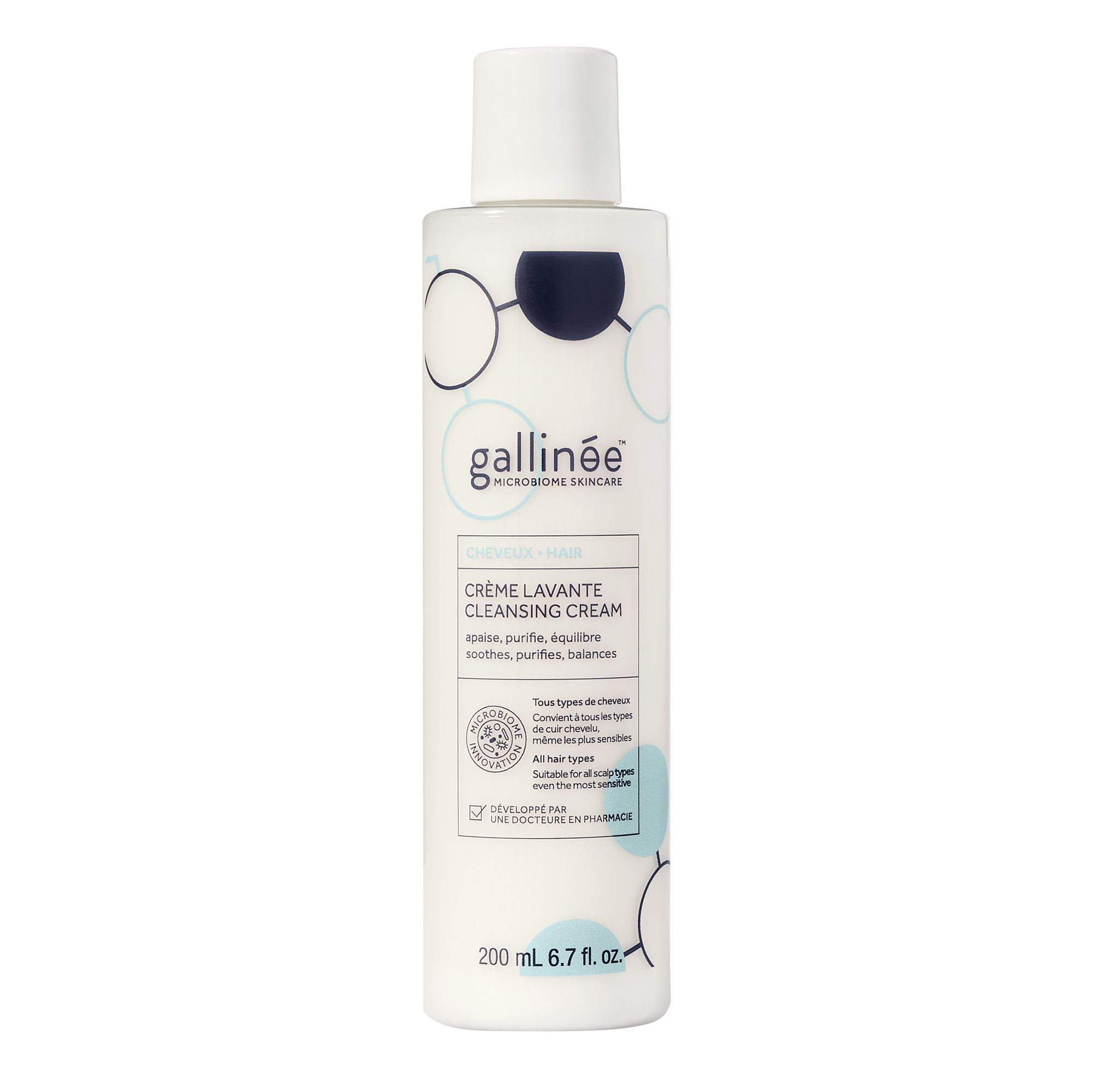 Flacon de shampooing blanc avec graphiques bleus et blancs. Texte : Crème Lavante, 200 ml, pour cuir chevelu sensible.