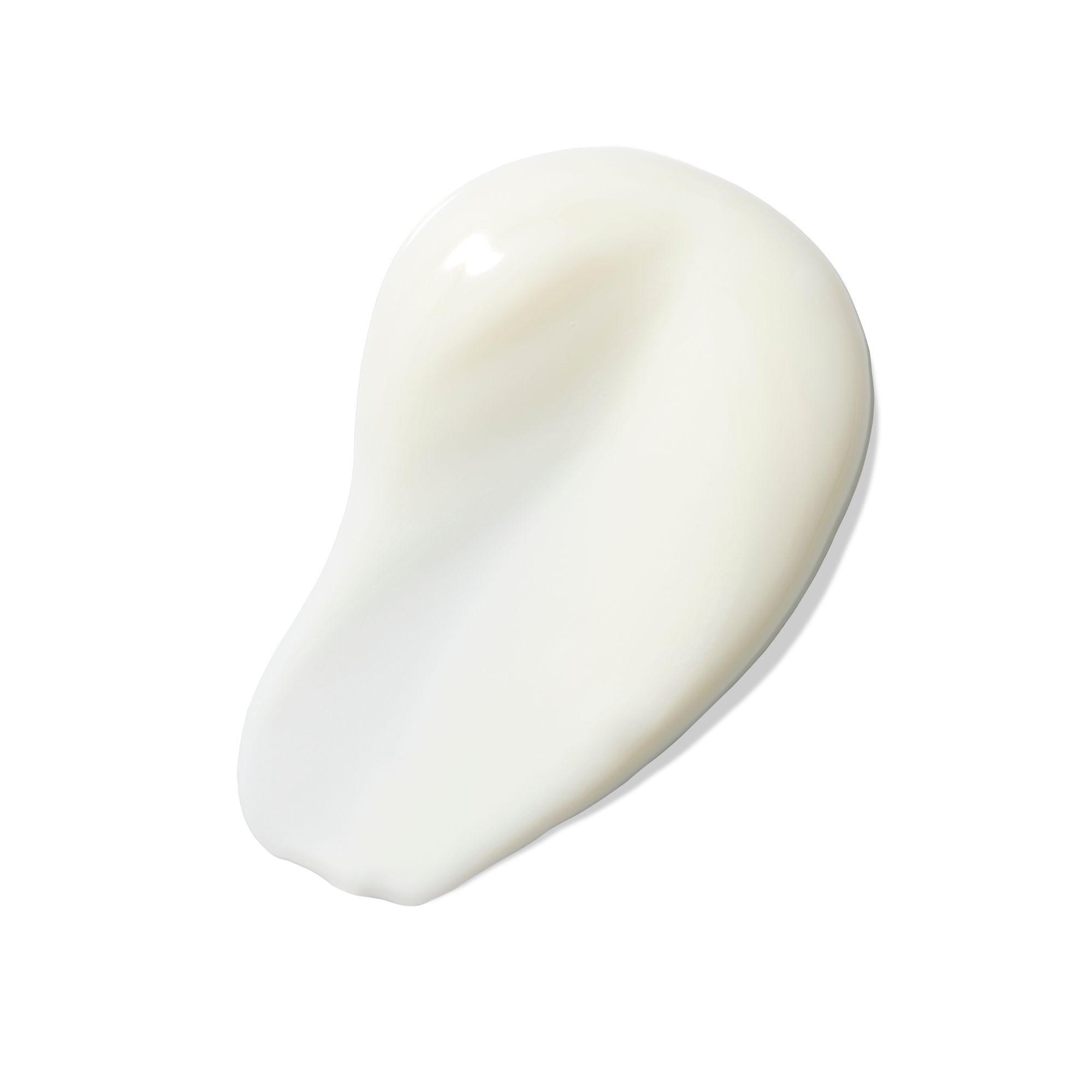 Tache de crème blanche sur fond blanc. Texture brillante.