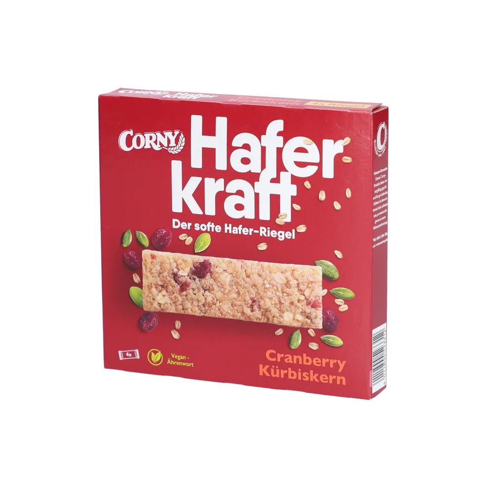 Emballage rouge Corny Haferkraft. Barre de céréales Cranberry-Kürbiskern. Ingrédients visibles. Vegan.