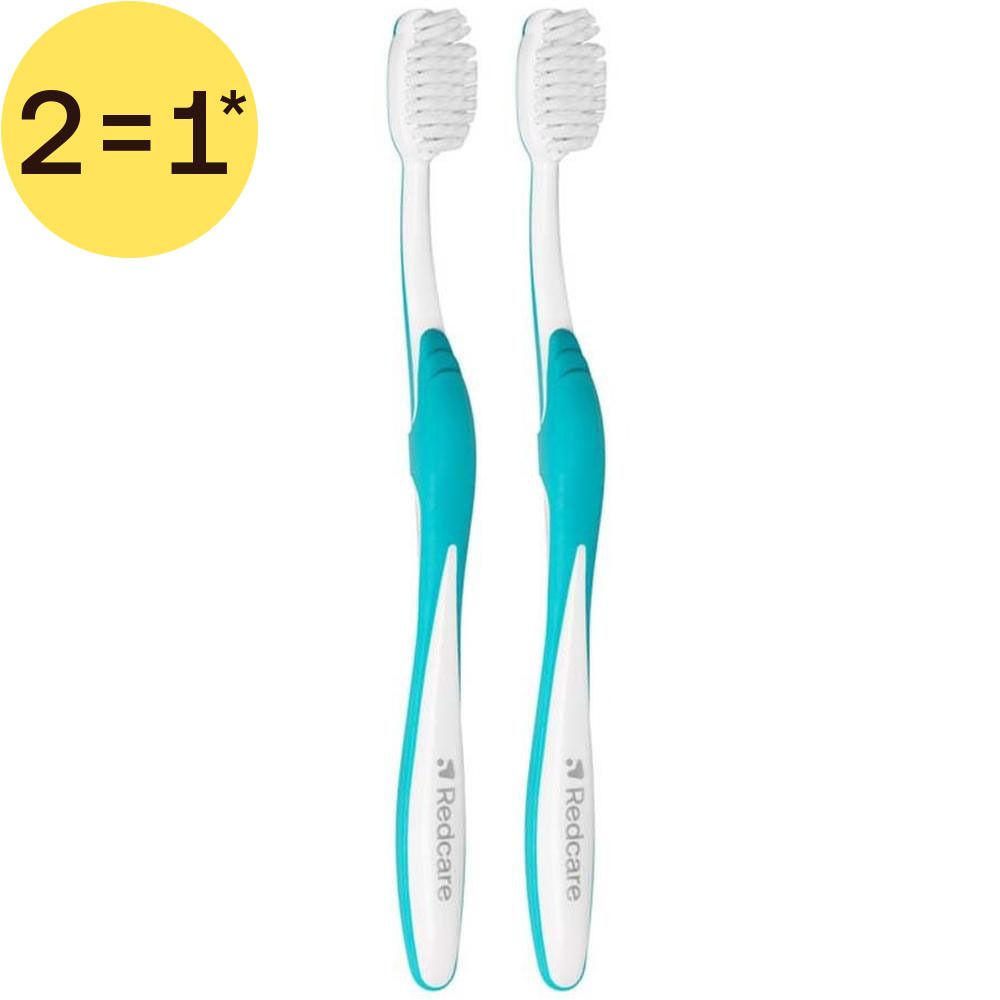 Deux brosses à dents Redcare Super Sensitiv, rose et blanc, emballées.
