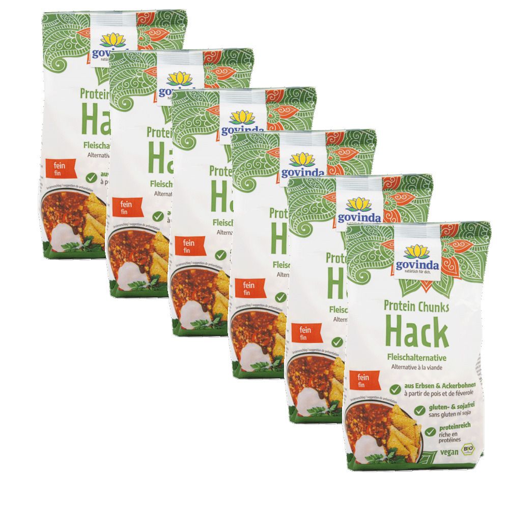 Plusieurs sachets de Protein Chunks Hack, alternative végétalienne à la viande. Marque Govinda. Emballage vert et blanc avec image.