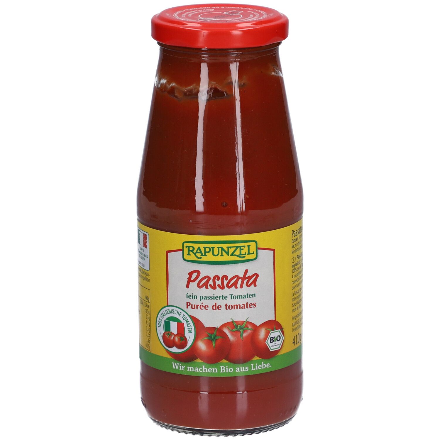 Glasflasche mit roter Flüssigkeit. Etikett mit "Rapunzel Passata", Tomaten-Illustrationen und Bio-Siegel.