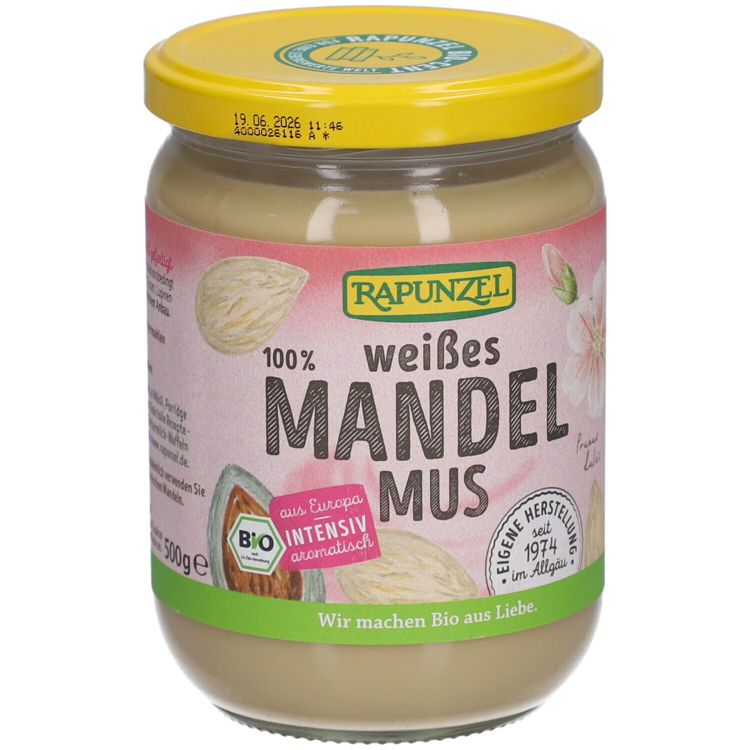 Glas mit weißem Mandelmus. Aufschrift: RAPUNZEL, weißes Mandelmus, Bio. Mit gelbem Deckel. 500g.