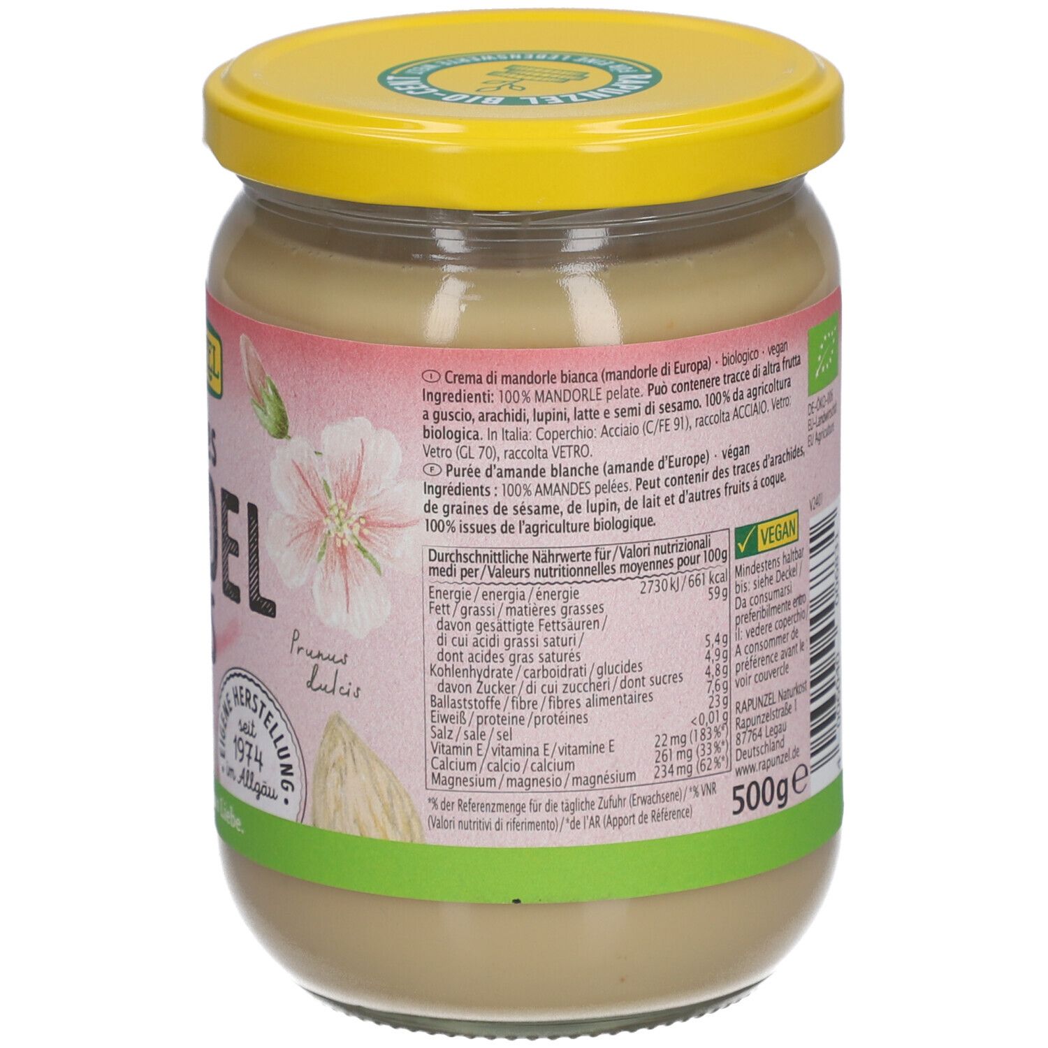 Glas mit weißem Mandelmus. Rückseite mit Text, Nährwertangaben und Bio-Siegel. Gelber Deckel. 500g.