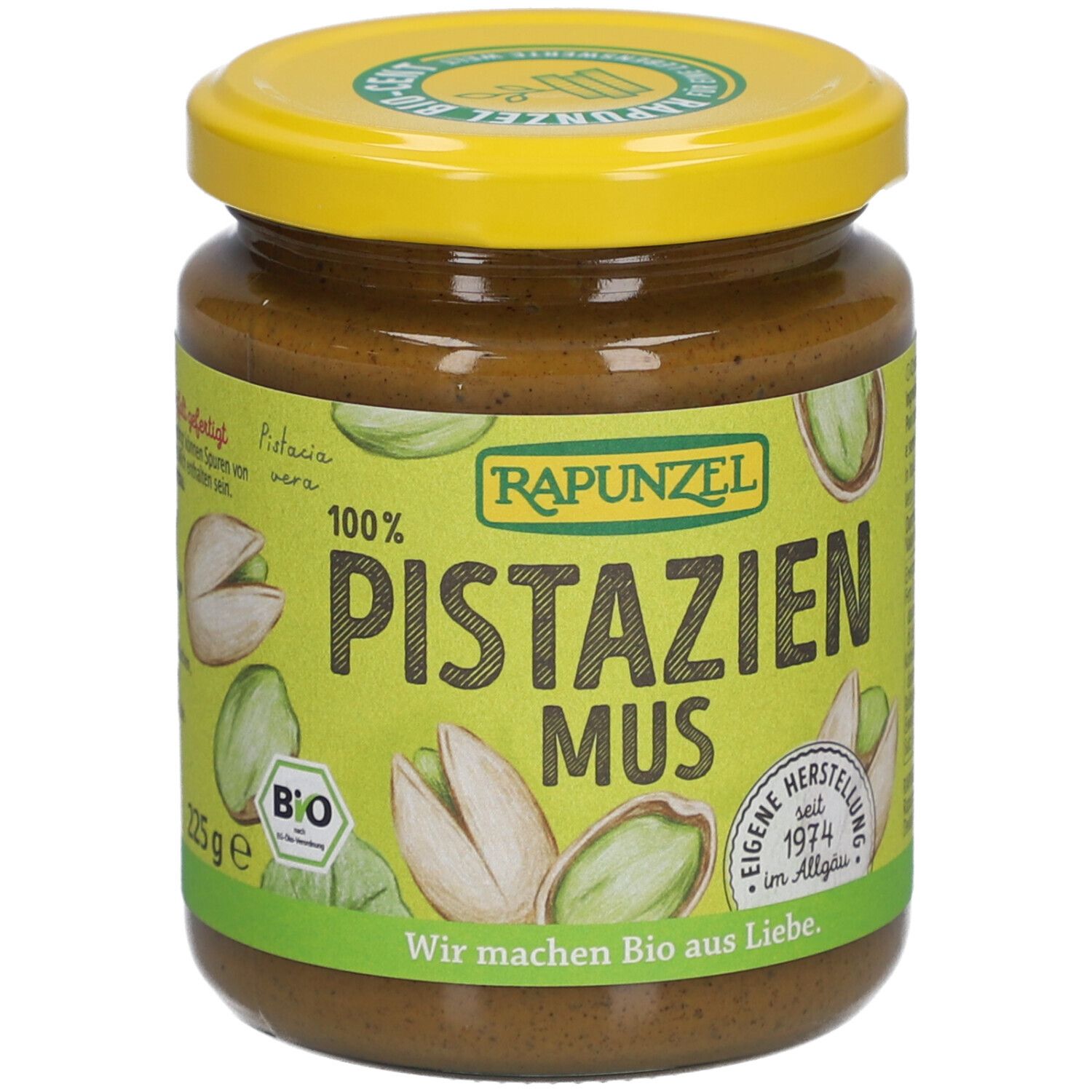 Glas Rapunzel Pistazienmus. Gelber Deckel, grünes Etikett mit Pistazien-Illustrationen und Text. 225g.