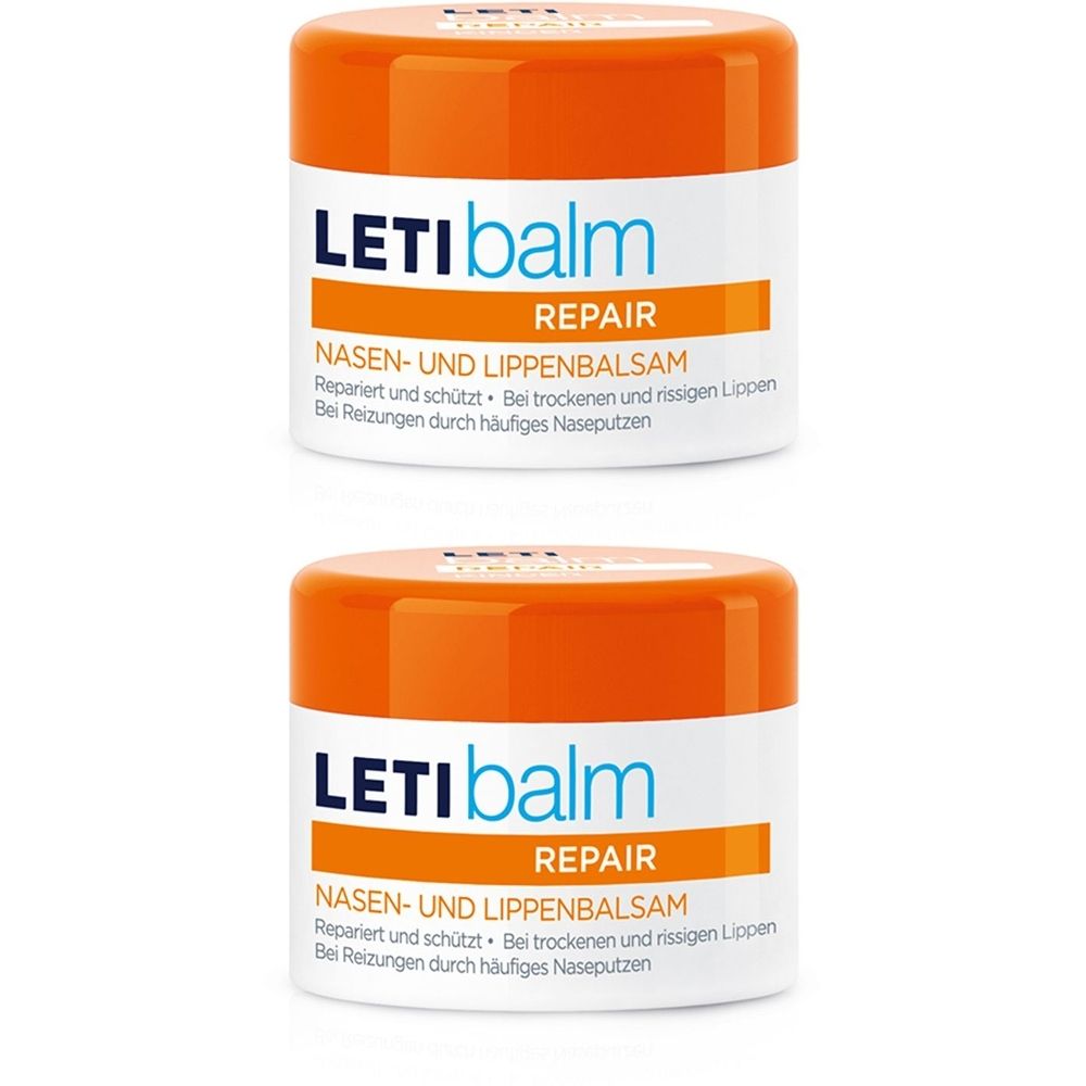 Deux pots de LETI balm. Couvercle orange, contenant blanc. Inscription : LETI balm, REPAIR, NASEN- UND LIPPENBALSAM. Texte : Répare et protège. Pour lèvres sèches et gercées.
