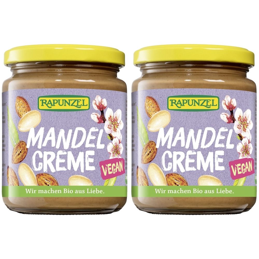 Zwei Gläser Mandelcreme mit gelben Deckeln. Auf den Etiketten steht "RAPUNZEL MANDEL CREME VEGAN".