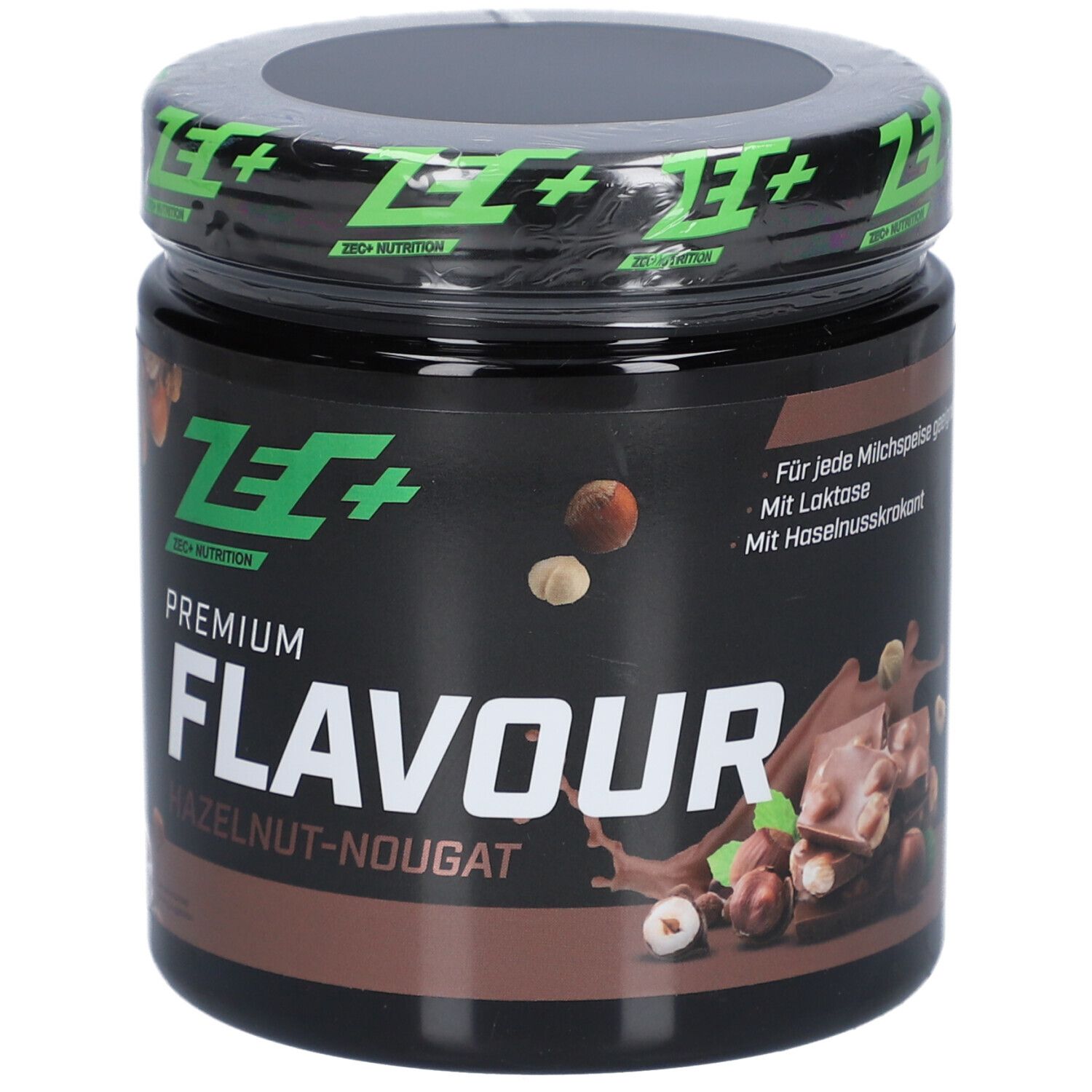Pot avec couvercle vert. Inscription: ZEC+ NUTRITION. PREMIUM FLAVOUR HAZELNUT-NOUGAT. Avec lactose.