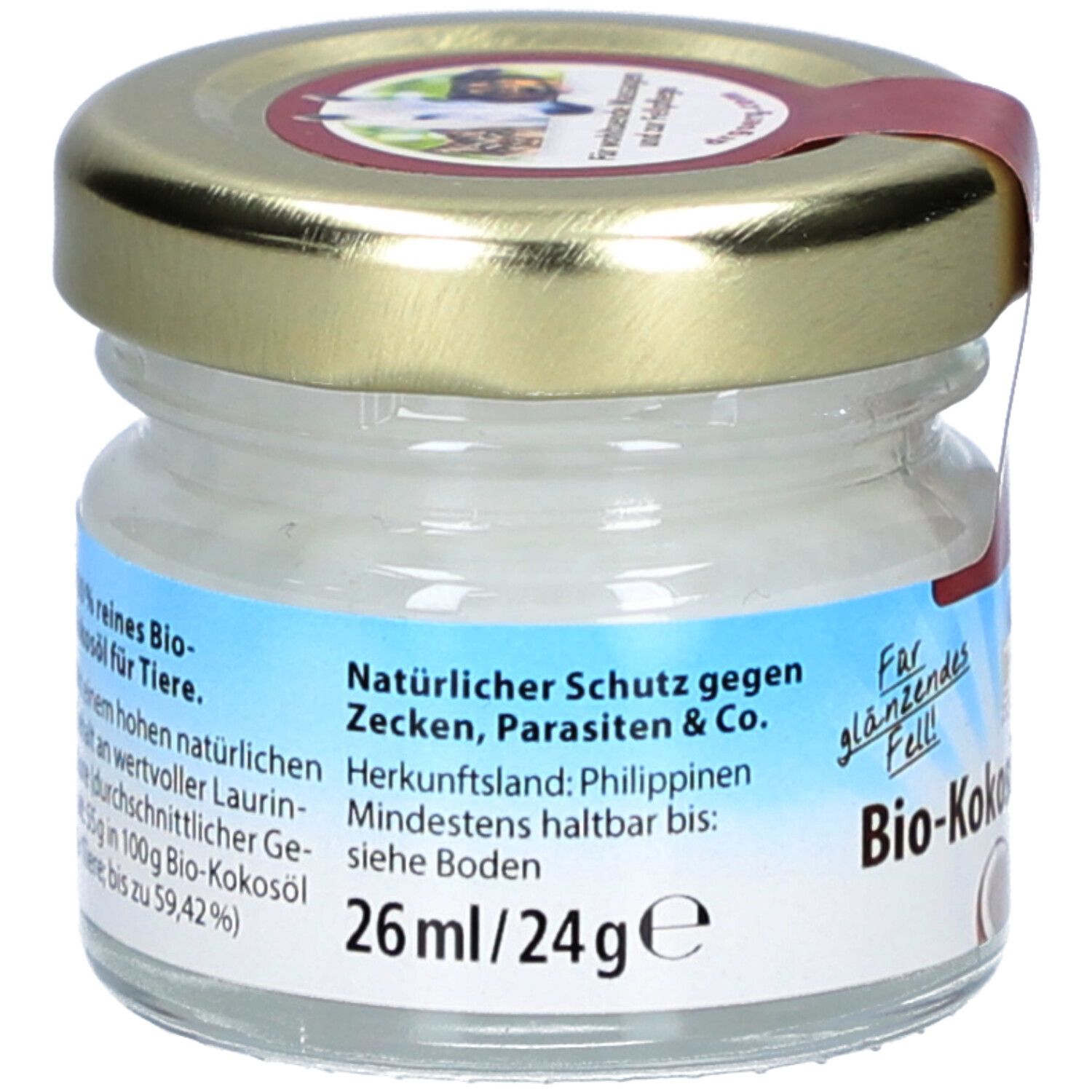 Pot de Bio-Kokosöl pour animaux. Étiquette avec texte: Protection naturelle contre les tiques, parasites & Co. 26ml/24g. Origine: Philippines.