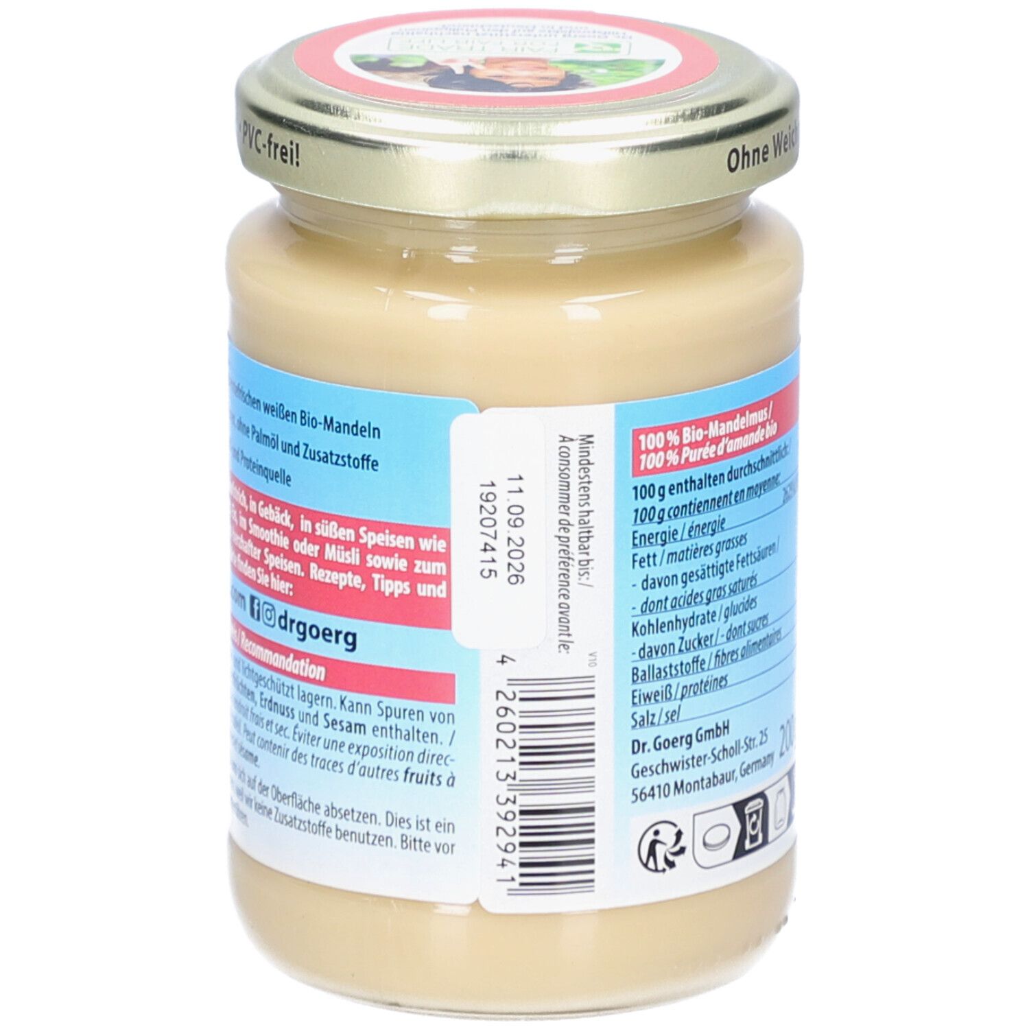 Rückseite des Glases mit Bio-Mandelmus. Mindesthaltbarkeitsdatum, Nährwertangaben. Aufschrift: Dr. Goerg.