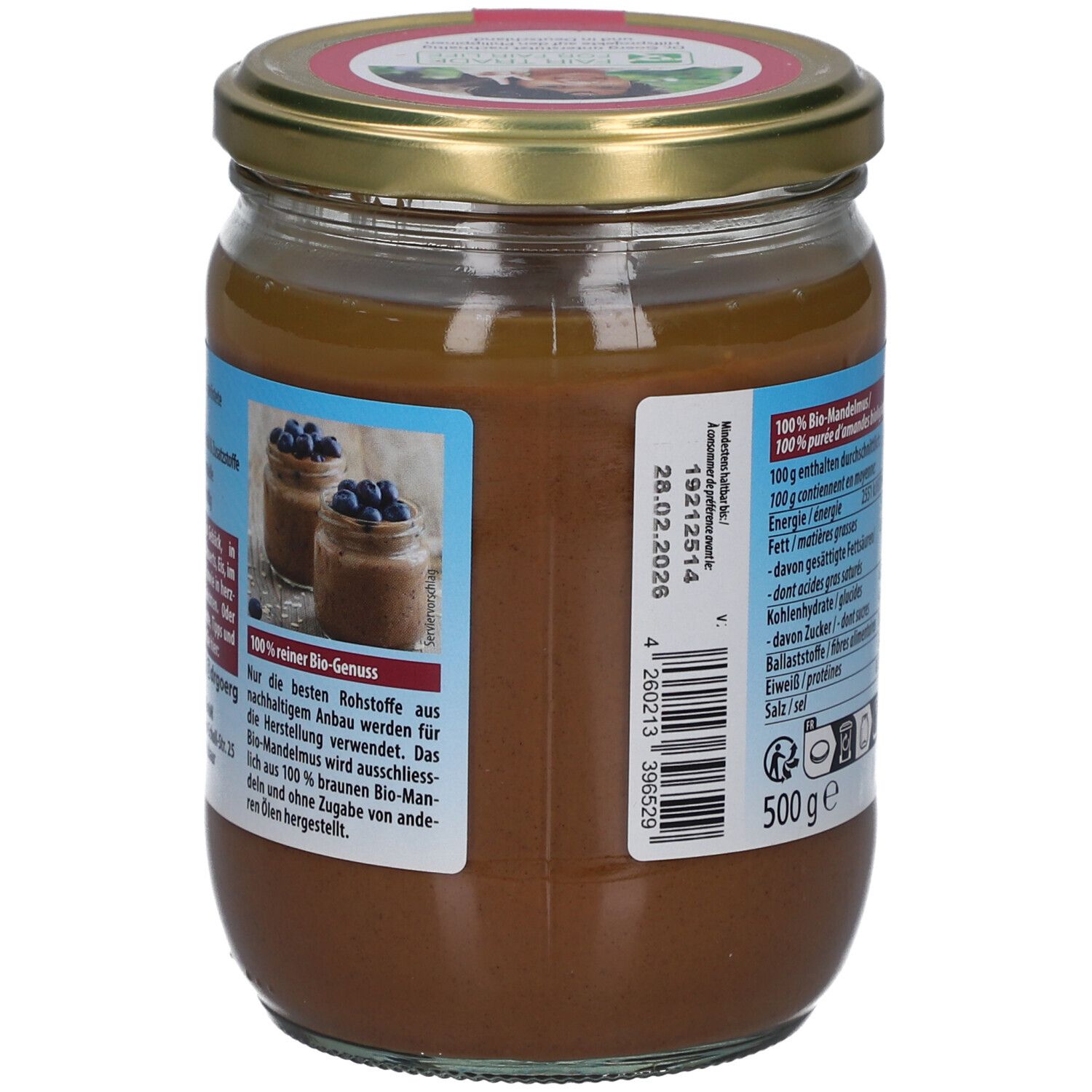 Rückseite des Glases mit braunem Mandelmus. Text mit Informationen und Nährwertangaben. 500g. Haltbarkeitsdatum.