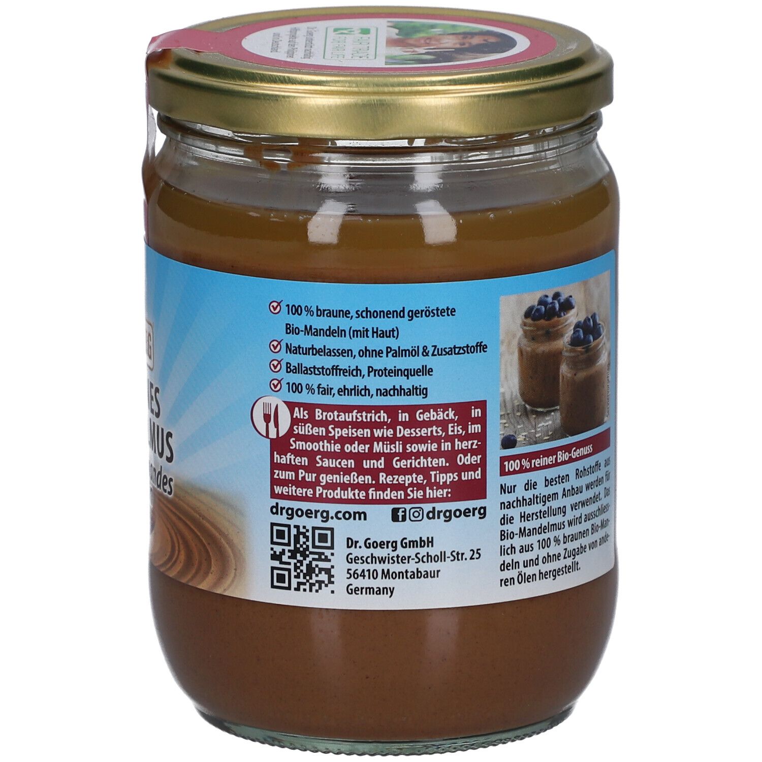 Rückseite des Glases mit braunem Mandelmus. Text mit Informationen und QR-Code. Dr. Goerg. 500g.