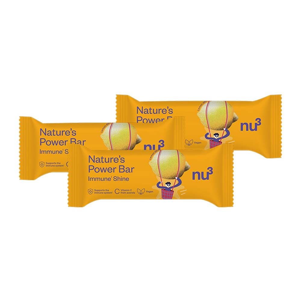 Quatre barres jaunes. Inscription : Nature's Power Bar, Immune Shine, nu3. Illustration d'un citron avec un visage.