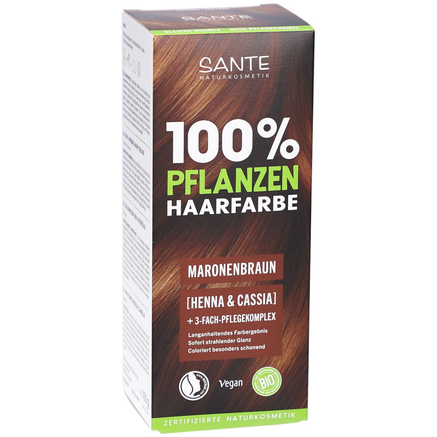 Face avant de l'emballage de la coloration végétale. Inscription: 100% Pflanzenhaarfarbe, Maronenbraun. Logo Vegan et label Bio.