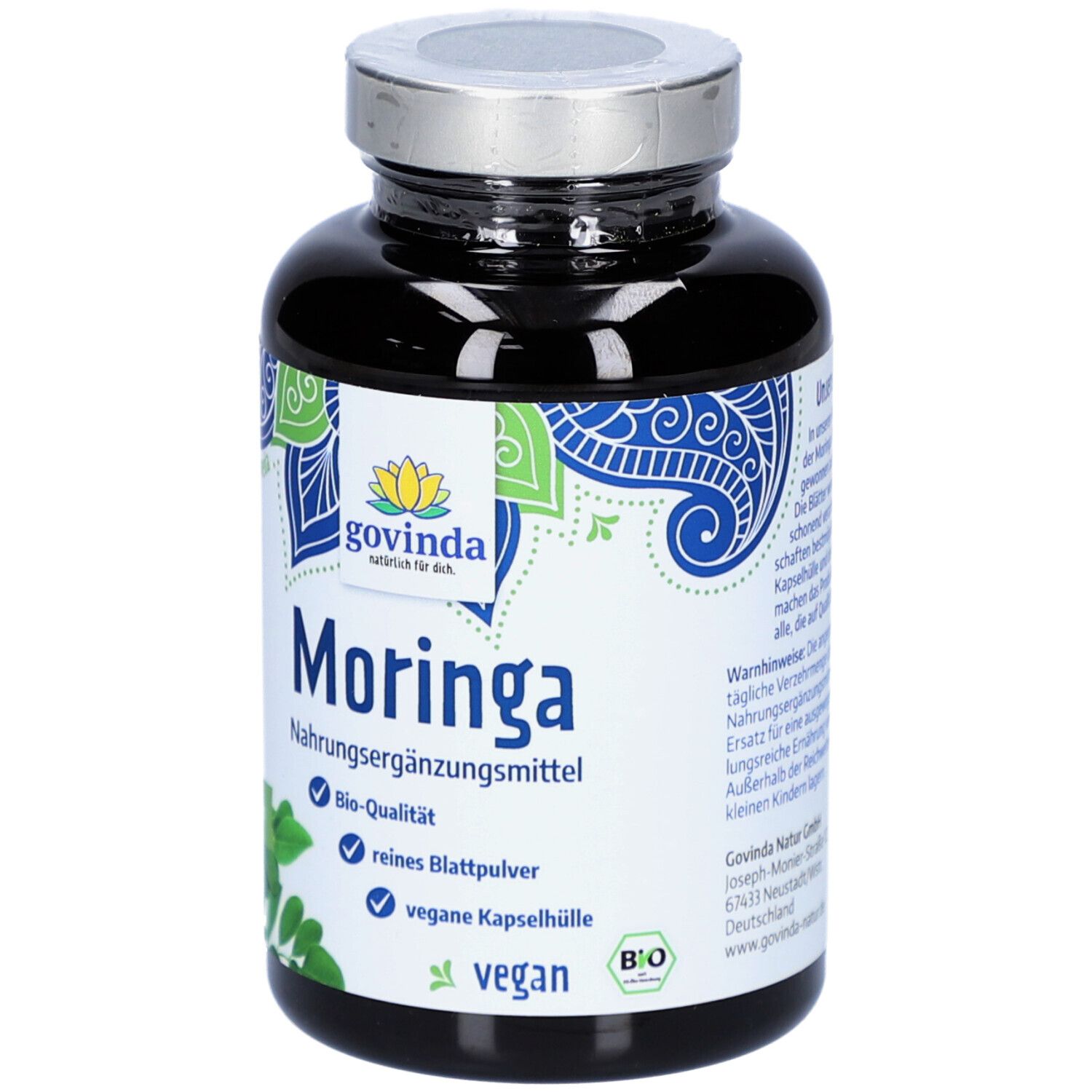 Flacon sombre de gélules de Moringa. Inscription : Govinda Moringa, complément alimentaire, qualité bio, végétalien.