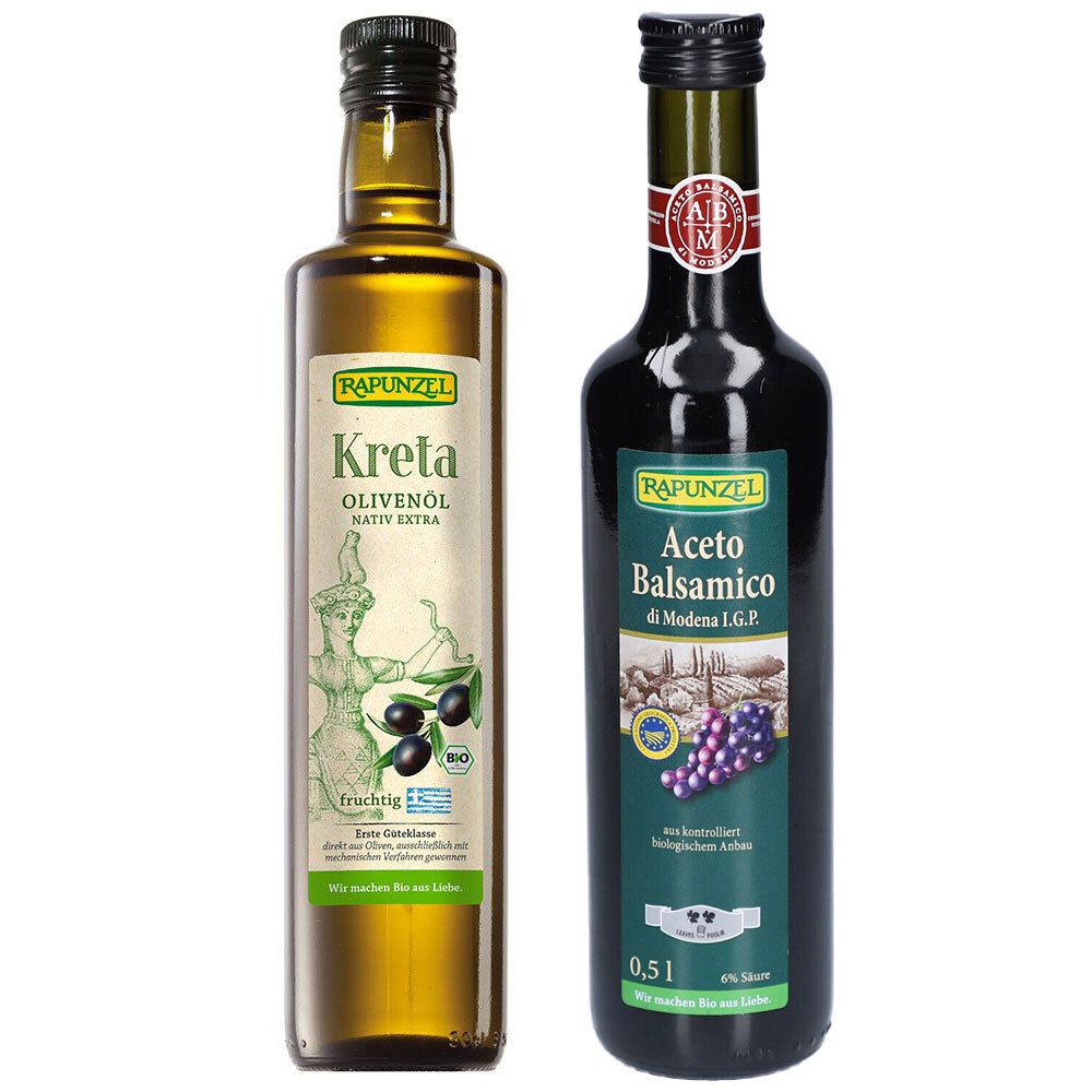 Deux bouteilles de Rapunzel : huile d'olive Kreta et vinaigre balsamique. Étiquettes, bouchons verts et noirs.