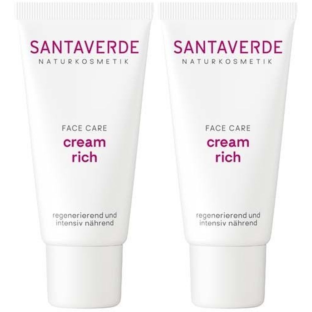 Deux tubes blancs avec texte violet. Inscription: SANTAVERDE, FACE CARE cream rich. Texte: regenerierend und intensiv nährend.