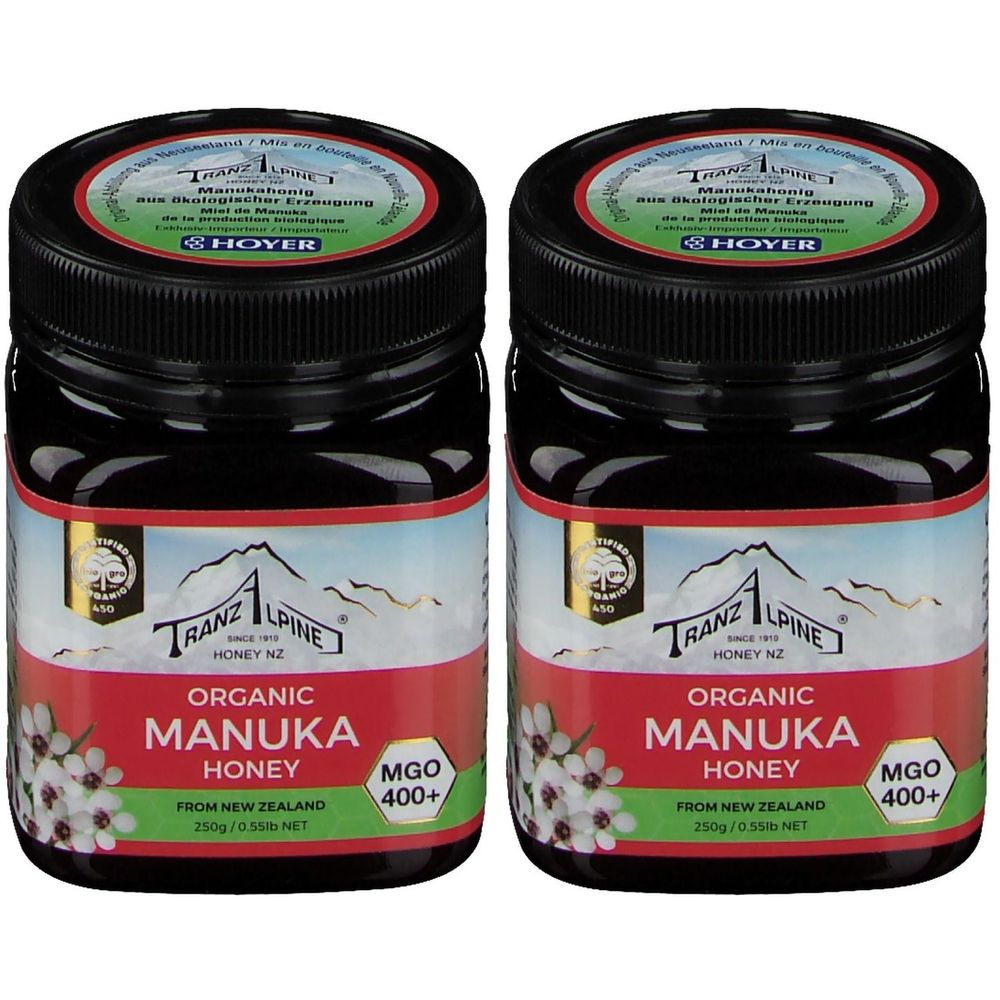 Zwei Gläser Honig. Schwarze Deckel, Etikett mit Text: Organic Manuka Honey, MGO 400+. Marke: Tranz Alpine.