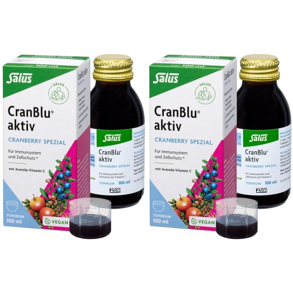 Zwei Flaschen und zwei Kartons Salus CranBlu aktiv. Aufdrucke: Cranberry Spezial, Vegan, 100 ml. Mit Messbechern.