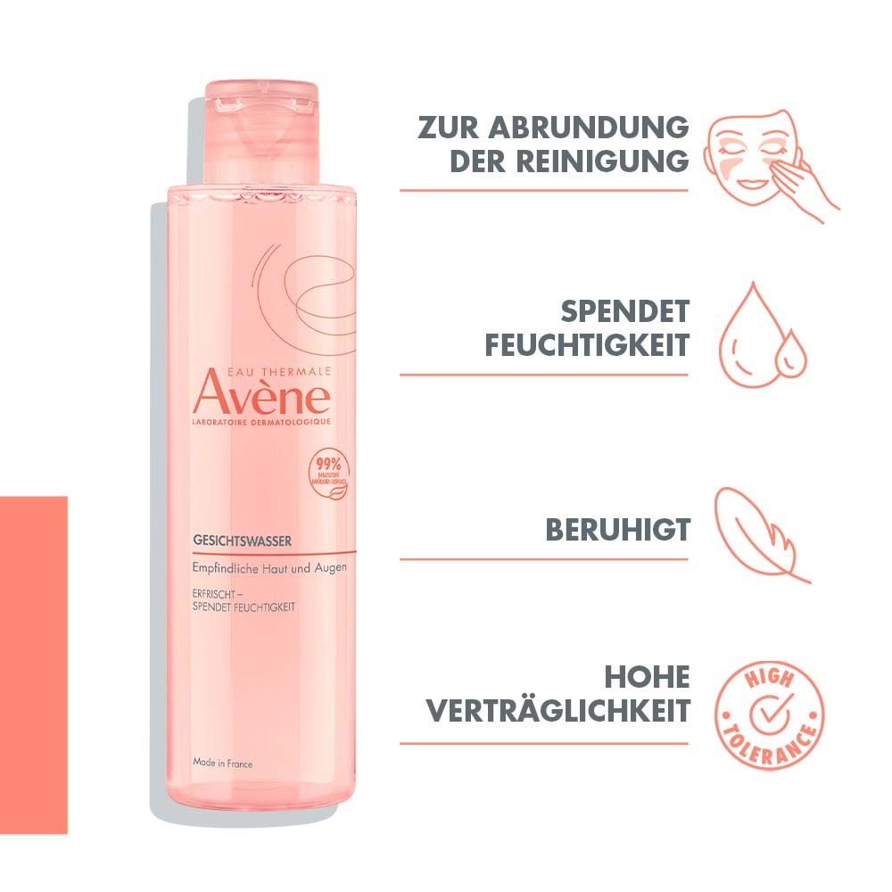 Flacon de lotion tonique avec liquide rose. Texte: Lotion tonique, pour peaux et yeux sensibles. Illustrations: goutte, plume, label qualité.