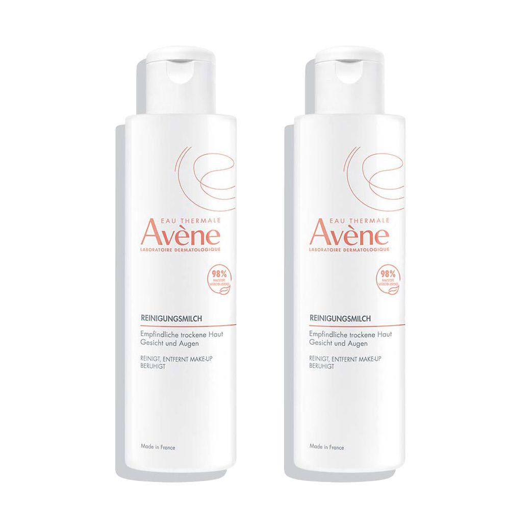 Deux flacons blancs avec bouchon rabattable. Inscription: Eau Thermale Avène, Lait nettoyant, pour peaux sèches. 98% d'ingrédients d'origine naturelle.
