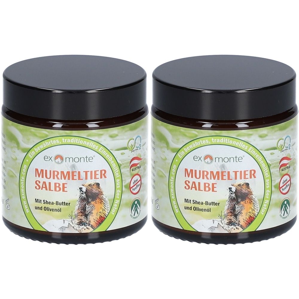 Zwei Gläser mit schwarzem Deckel. Auf den Etiketten steht "Murmeltiersalbe" mit einem Murmeltier-Bild. Grün-weißer Hintergrund.