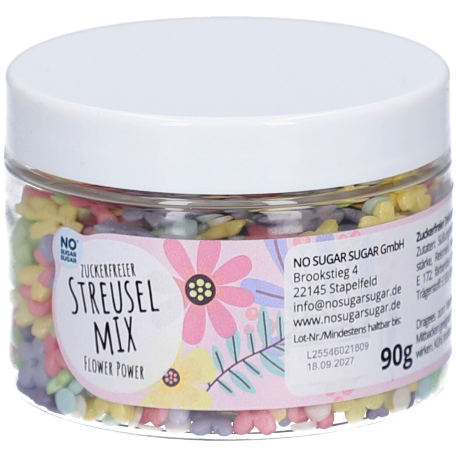 Pot transparent avec décorations florales colorées. Étiquette avec nom du produit, marque et poids : 90g. Couvercle blanc.