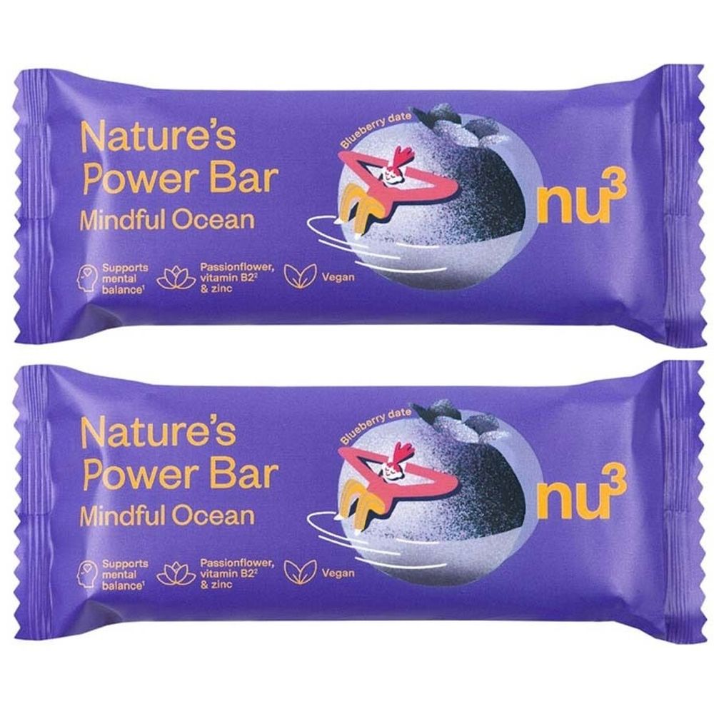 Deux barres emballées violettes. Inscription : Nature's Power Bar Mindful Ocean. Contient de la passiflore, de la vitamine B2 et du zinc. Vegan.