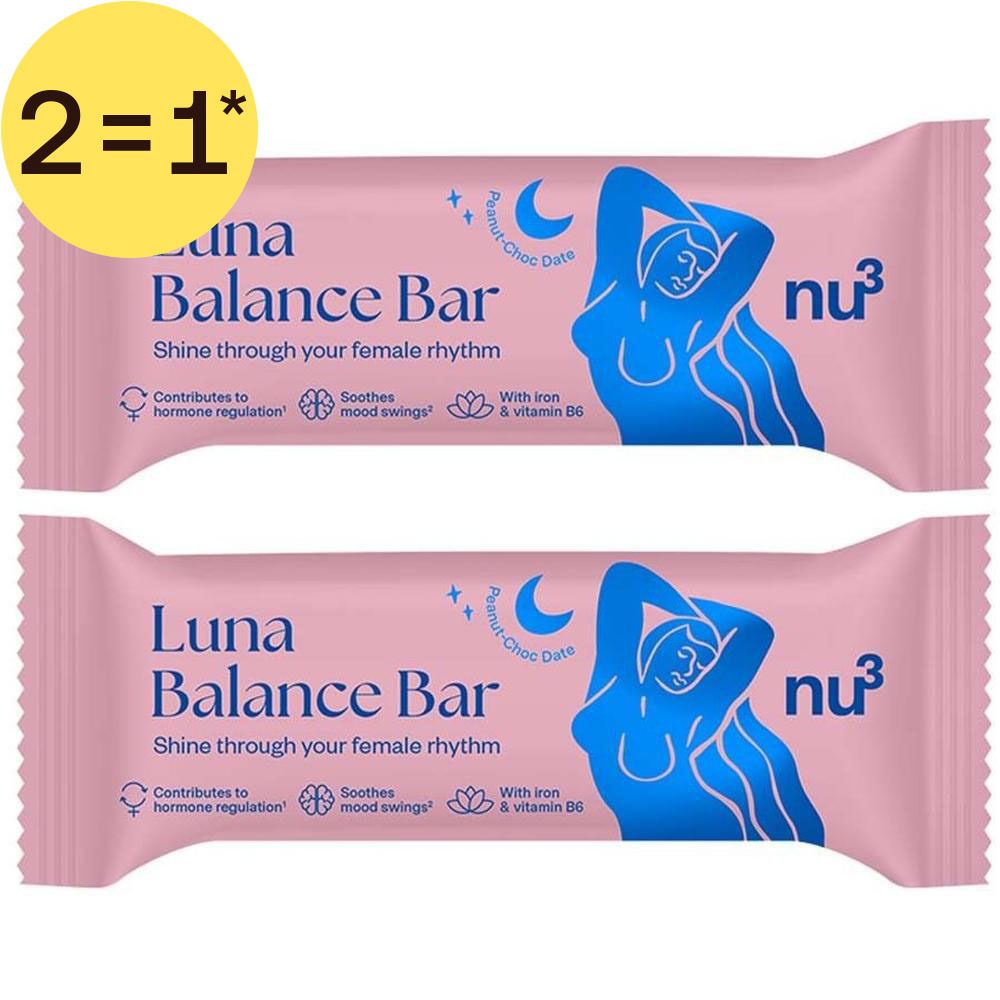 Deux barres nu3 Luna Balance dans un emballage rose avec inscription bleue. Un cercle jaune avec "2=1*" est placé en haut à gauche.