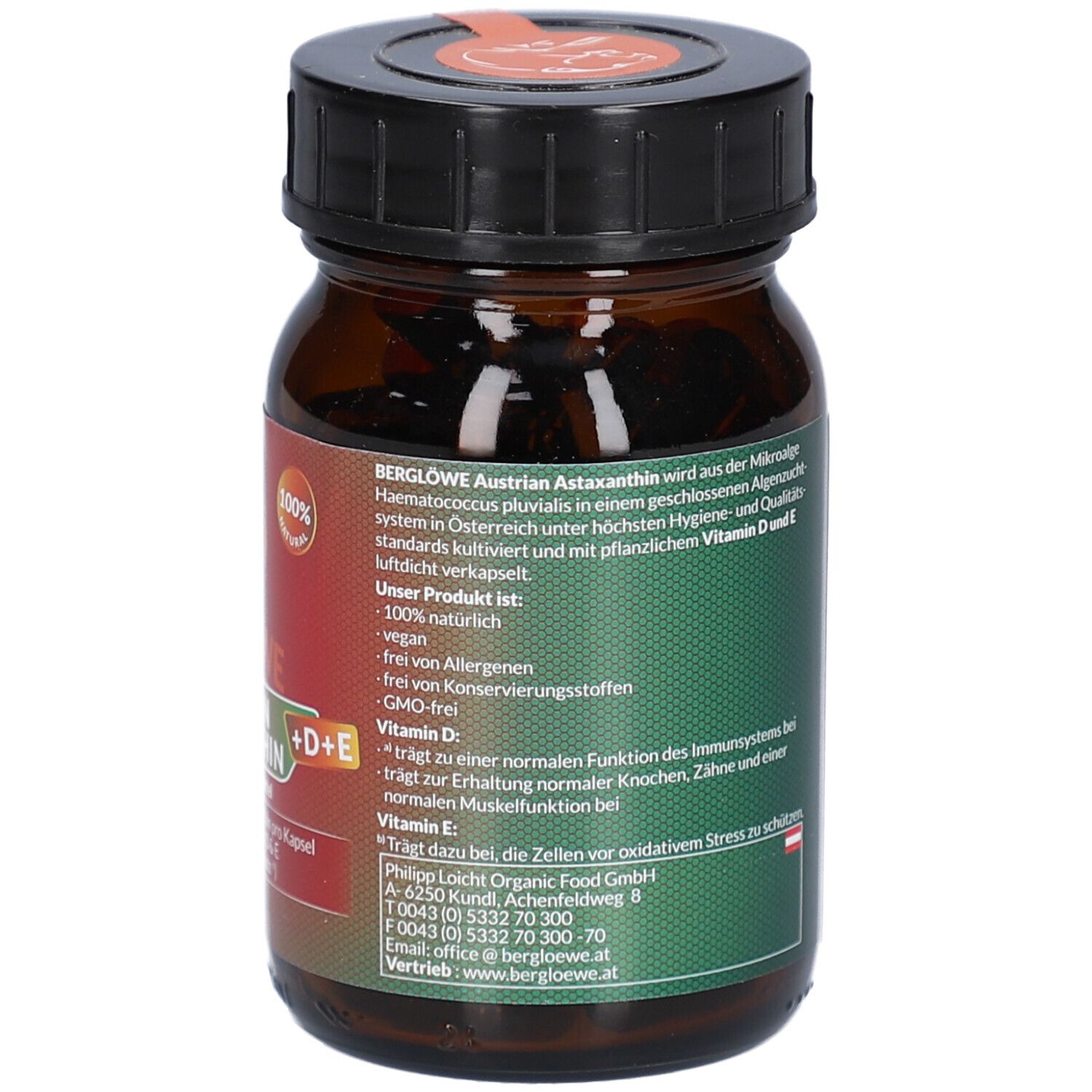 Dos du flacon en verre brun. Étiquette avec informations produit, adresse du fabricant et certifications.