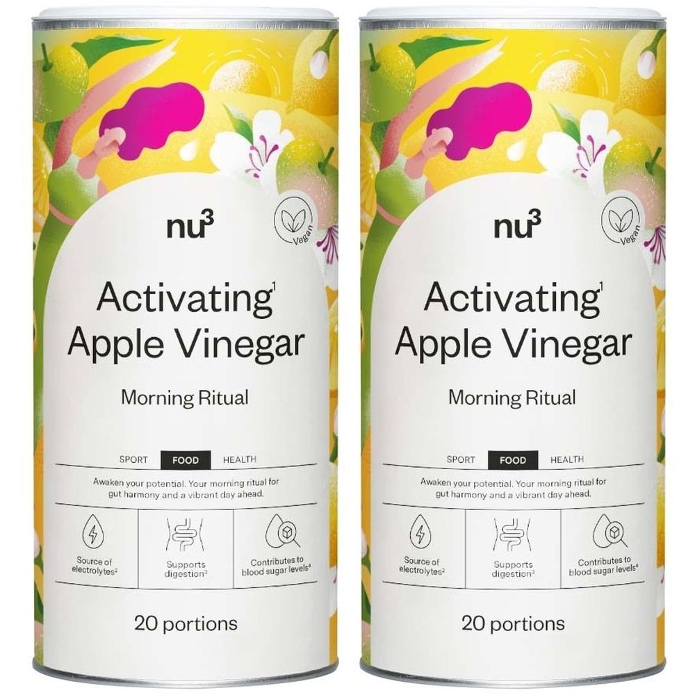 Deux contenants cylindriques avec étiquettes. Inscription: nu3 Activating Apple Vinegar, Morning Ritual. Logo végétalien. 20 portions. Illustrations.