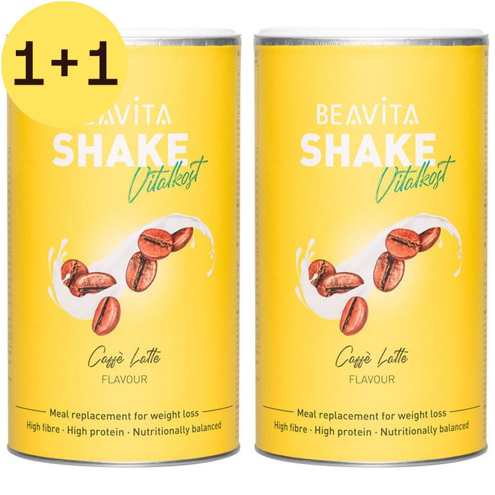 Deux boîtes jaunes BEAVITA Shake Vitalkost Caffè Latte avec autocollant 1+1. Illustration de grains de café et éclaboussures de lait. Texte: Meal replacement for weight loss.