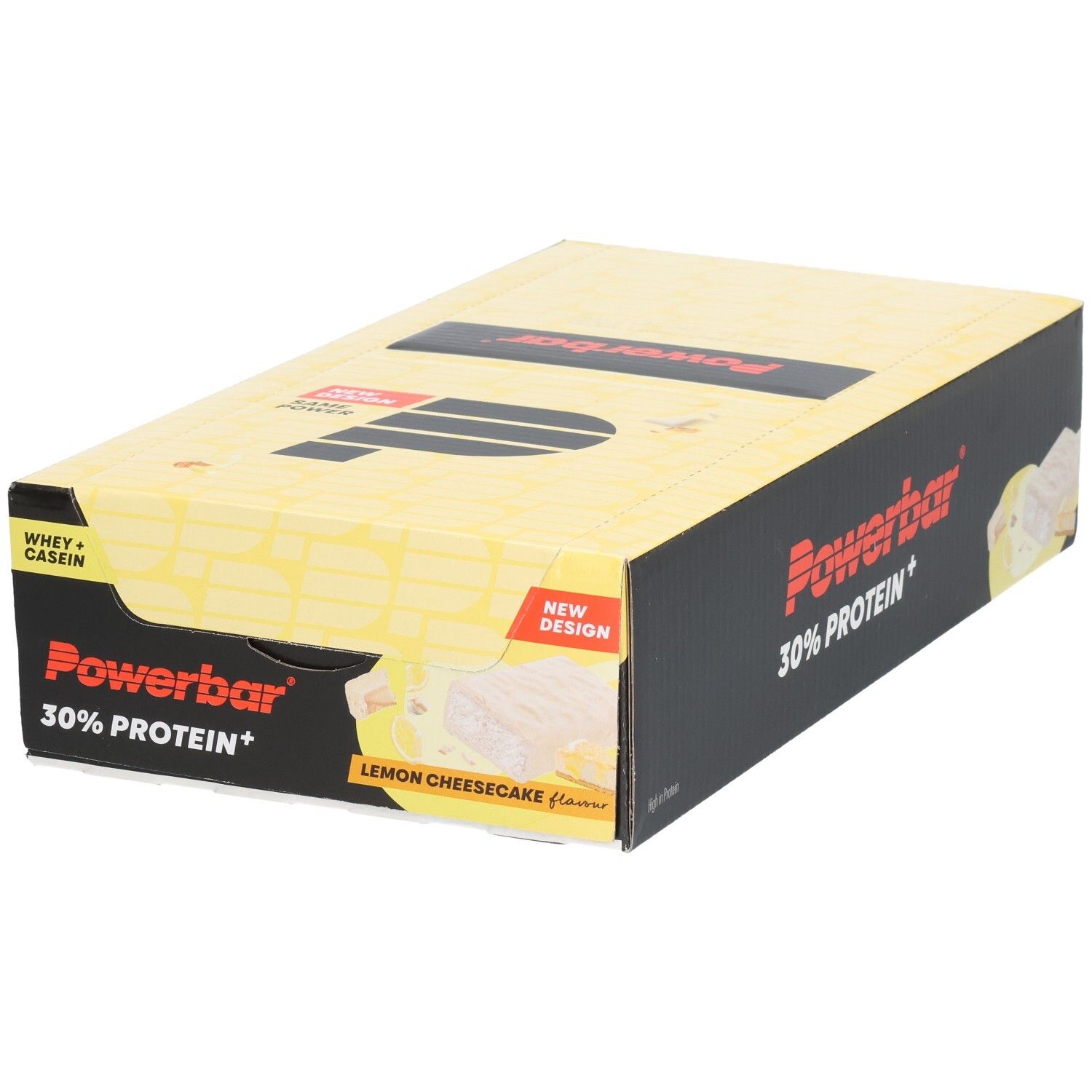 Gelbe Powerbar-Verpackung mit schwarzem Logo und Schriftzug. Enthält 30% Protein+. Aufdruck: Lemon Cheesecake. Neue Design-Kennzeichnung.