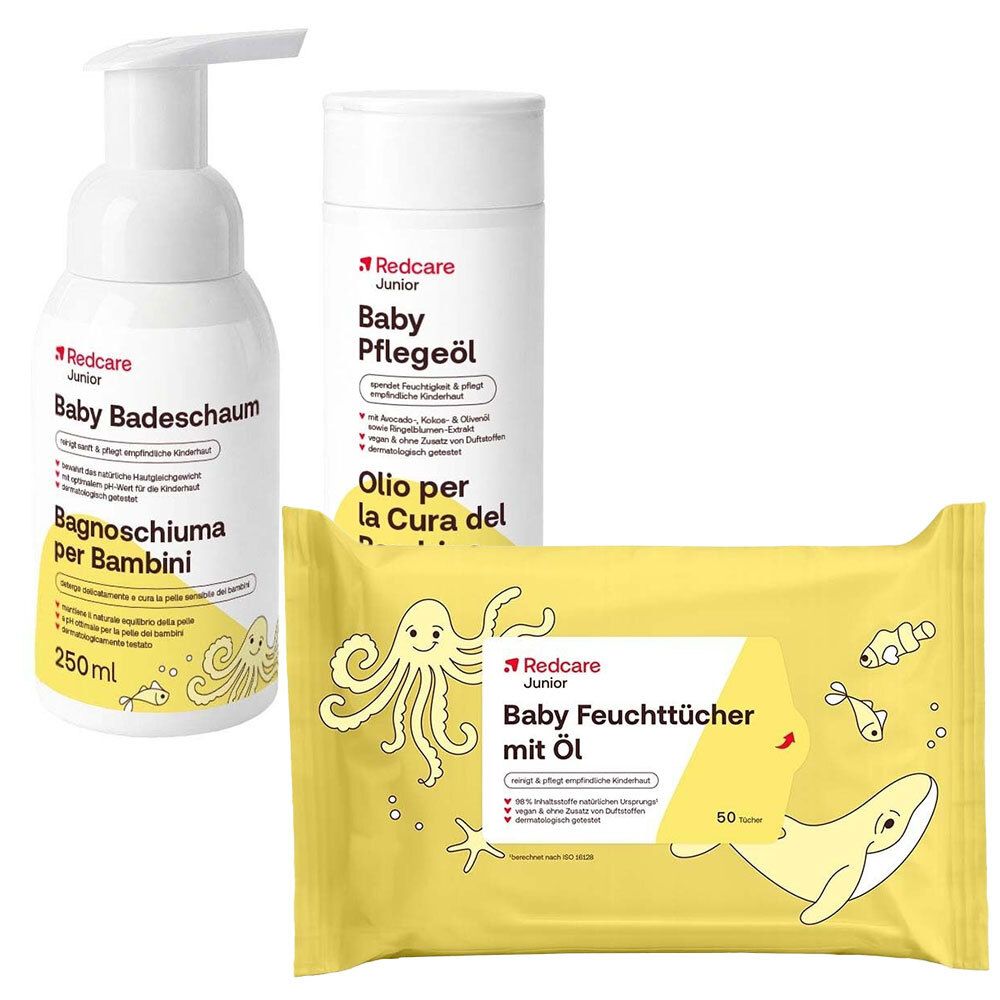 Trois produits de soins pour bébés : bain moussant, huile de soin et lingettes humides à l'huile. Tous avec le logo Redcare Junior.