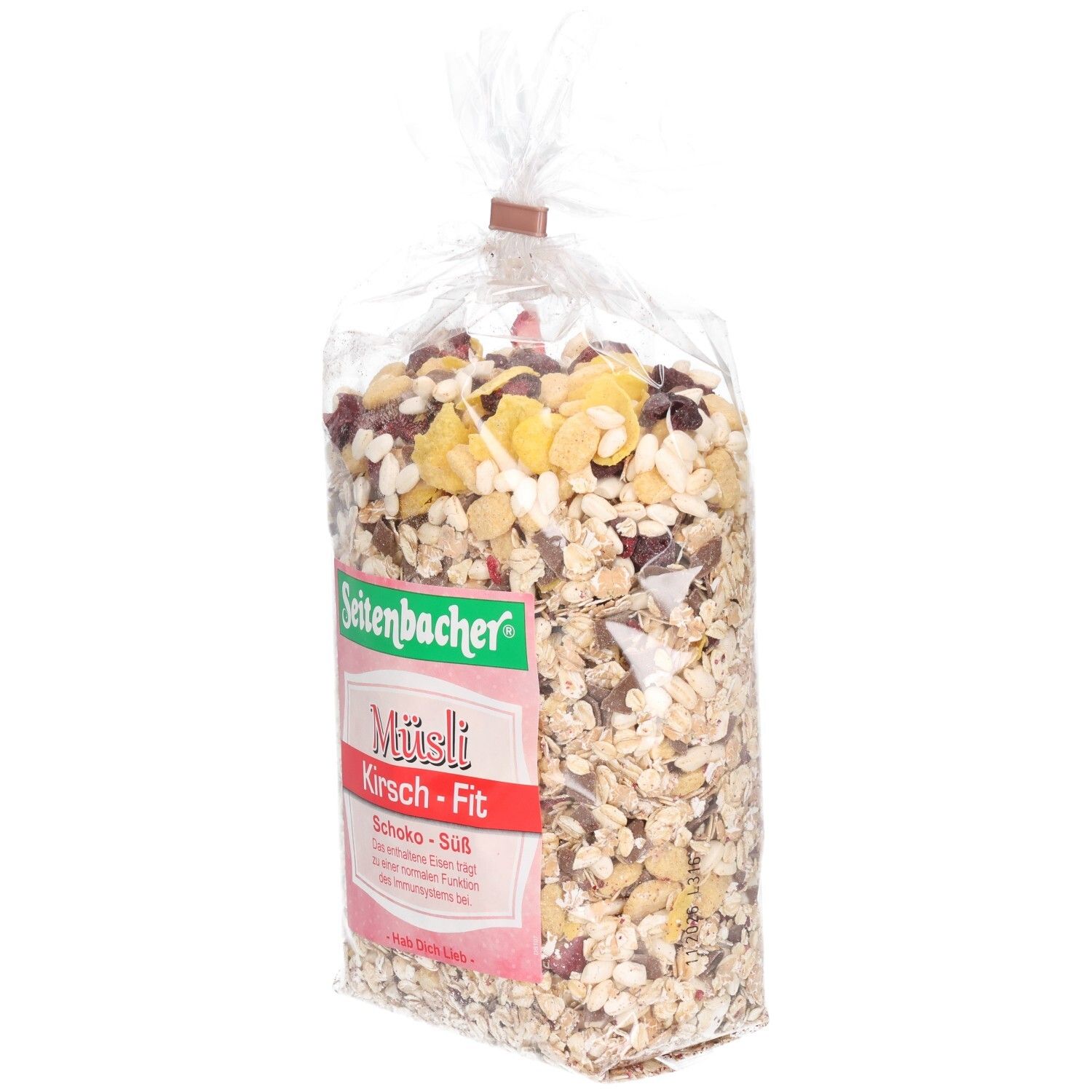 Transparente Tüte mit Müsli. Aufdruck: Seitenbacher, Müsli Kirsch-Fit, Schoko-Süß. Sichtbar sind Cerealien, Kirschen und Schokostücke.