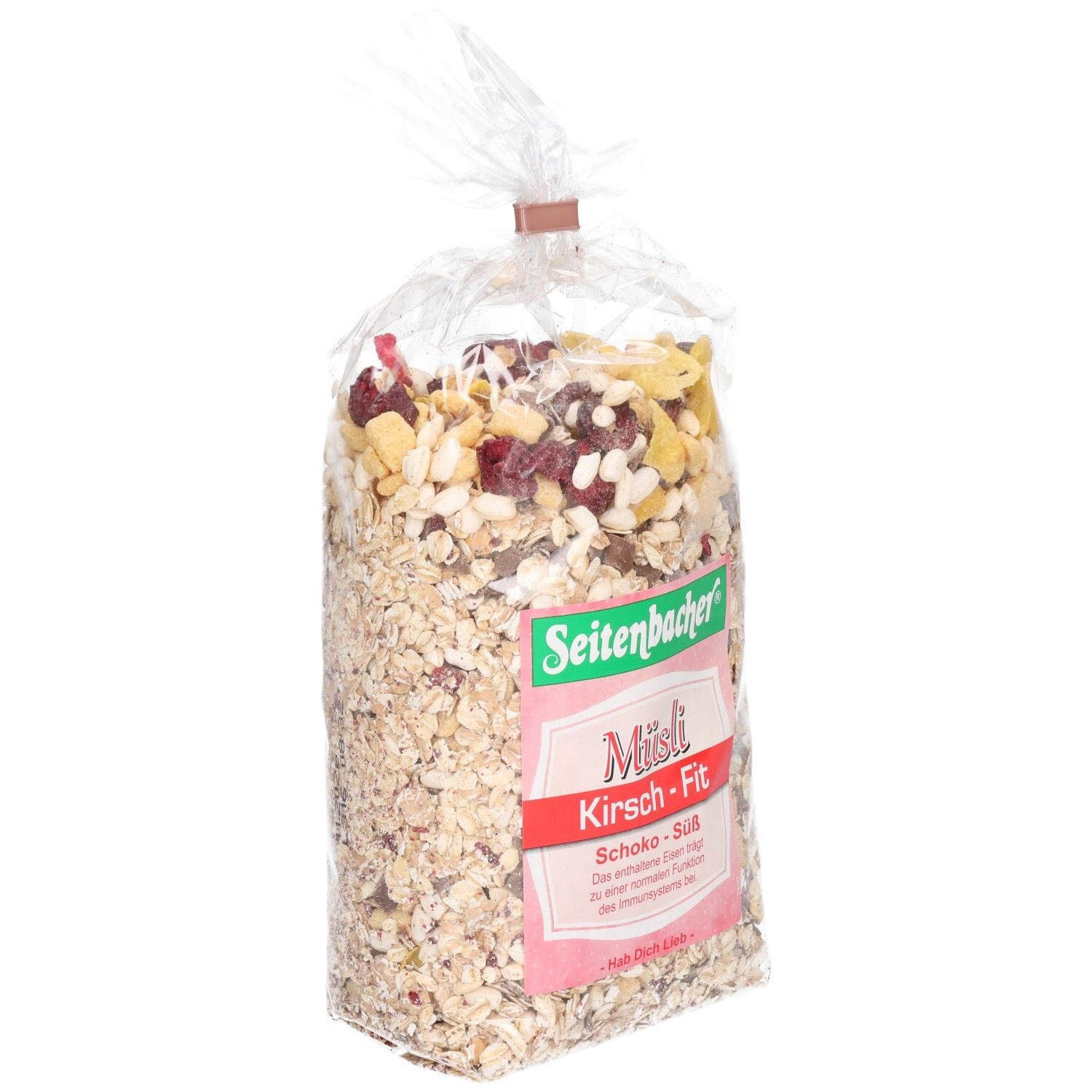 Transparente Tüte mit Müsli. Aufdruck: Seitenbacher, Müsli Kirsch-Fit, Schoko-Süß. Cerealien, Kirschen und Schokostücke sind sichtbar.