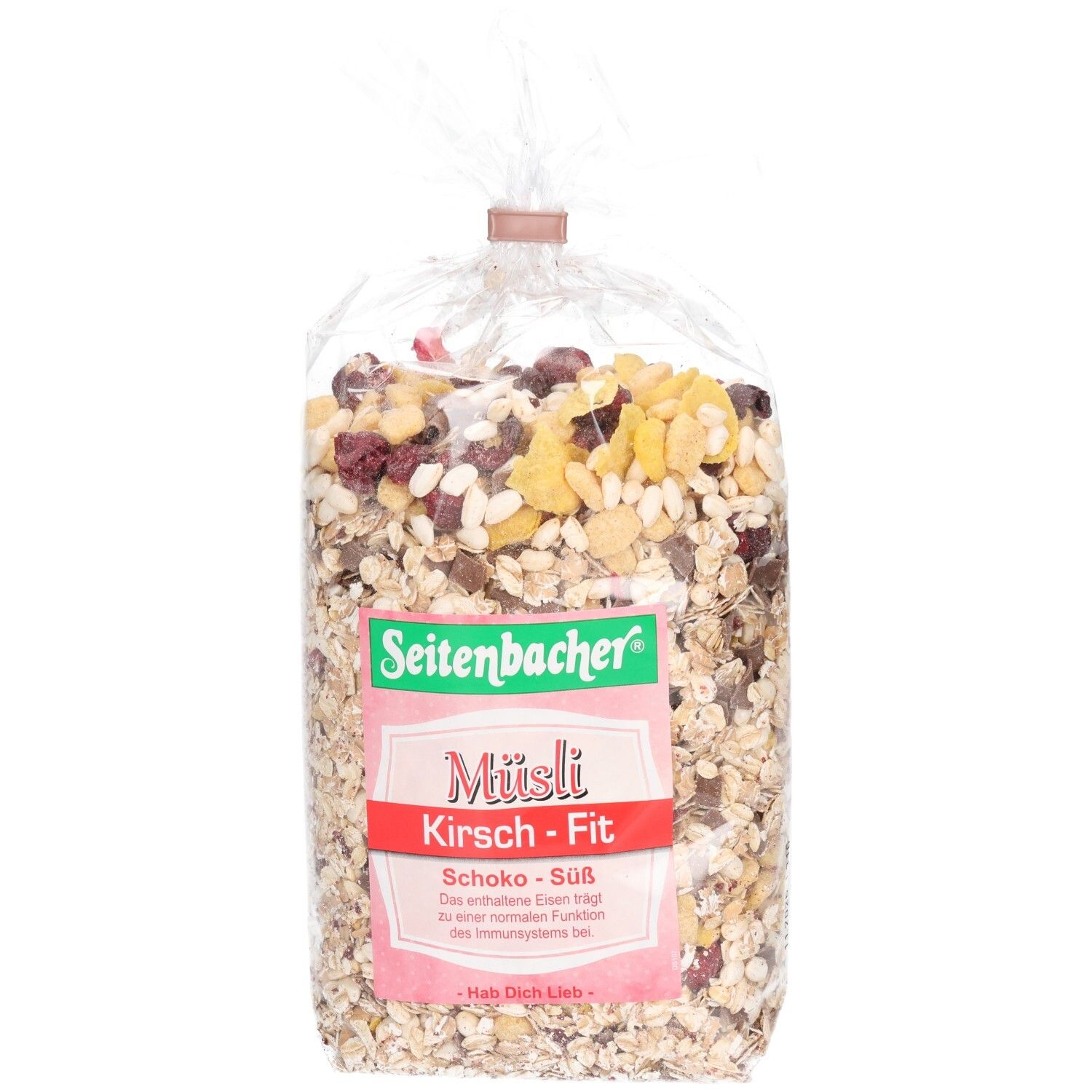 Transparente Tüte mit Müsli. Aufdruck: Seitenbacher, Müsli Kirsch-Fit, Schoko-Süß. Cerealien, Kirschen und Schokostücke sind sichtbar.