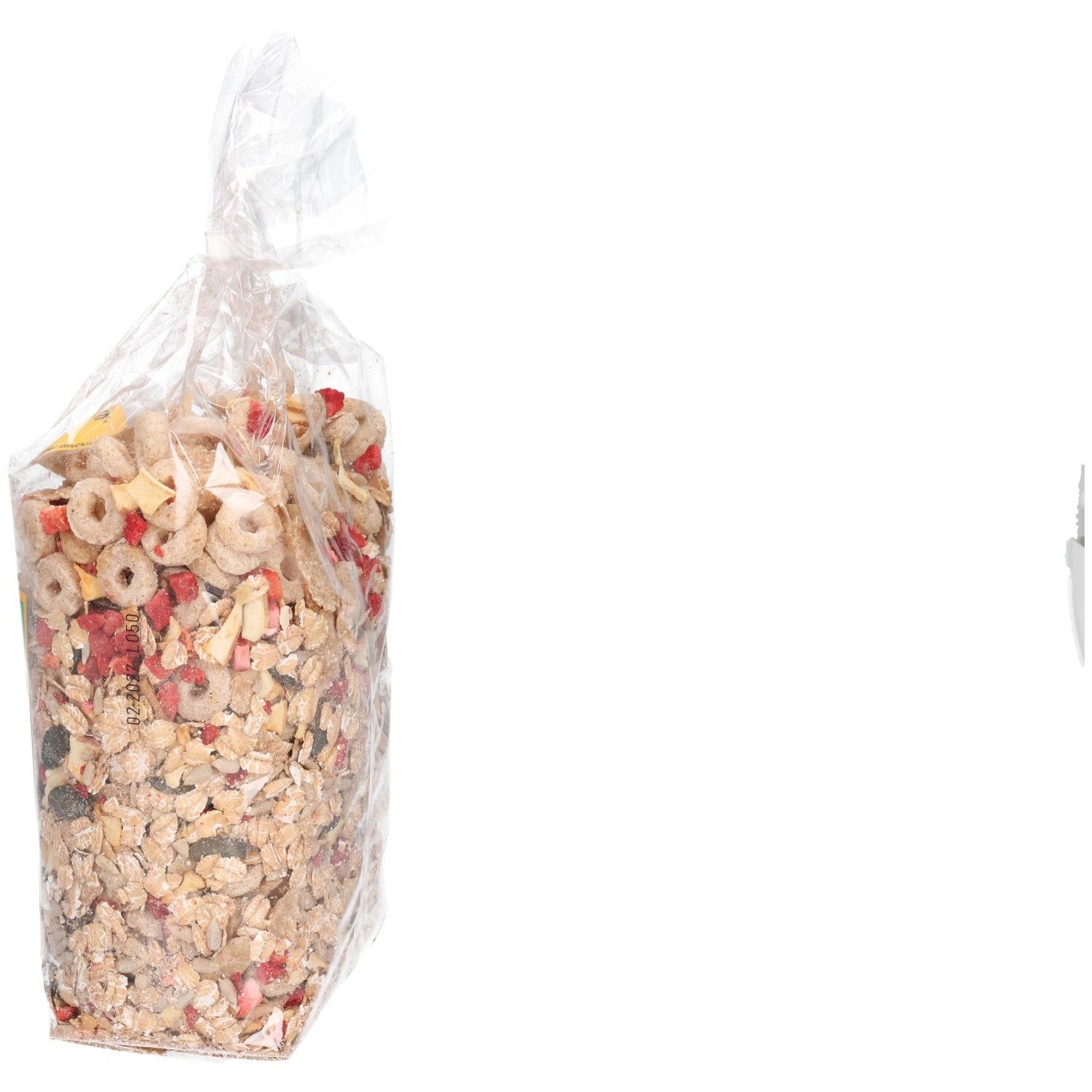 Transparente Tüte mit Müsli-Mischung. Seitenansicht. Der Inhalt ist sichtbar. Aufschrift: Dinkel-Mischung.